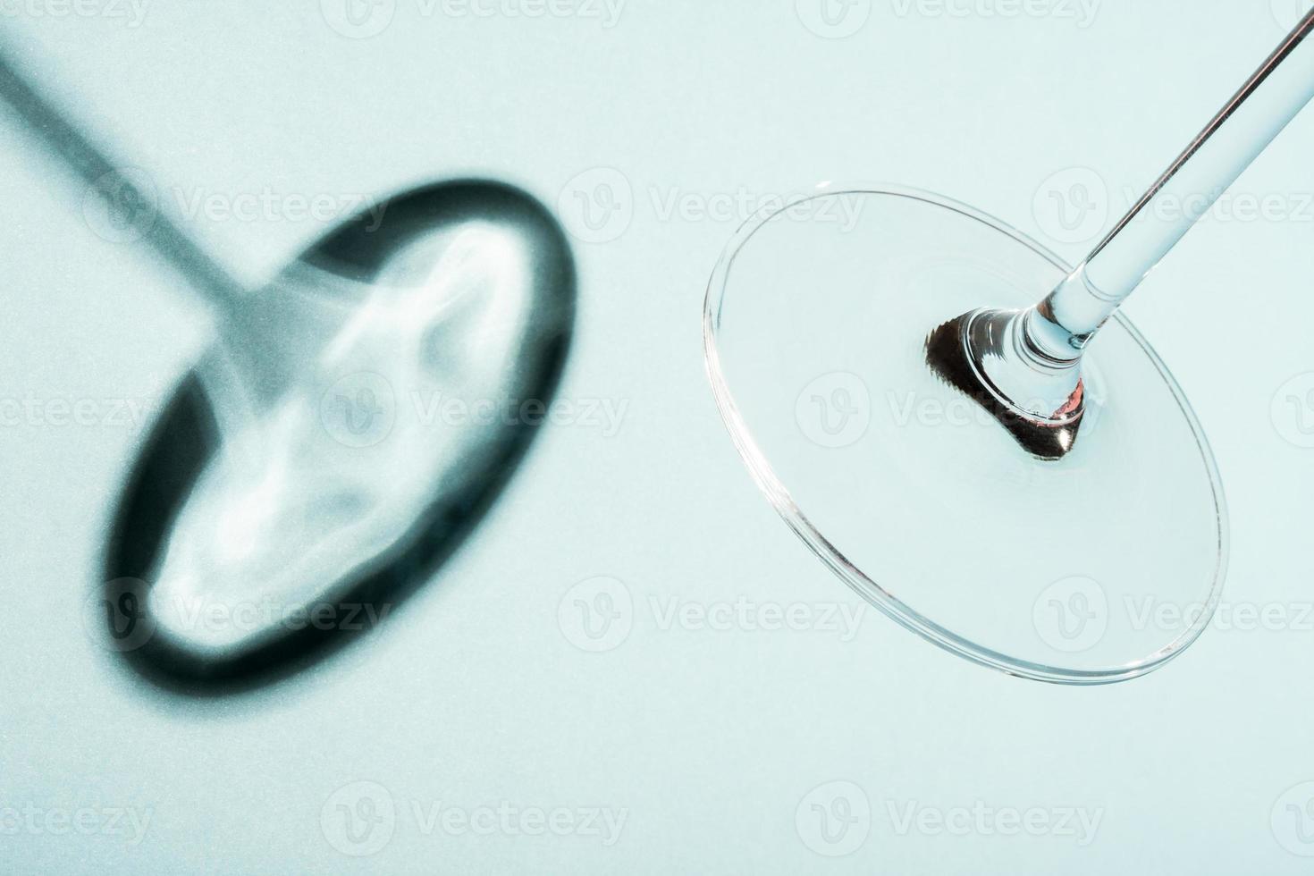 Wine glass stem and base with shadow on blue background. 7353685 Stock