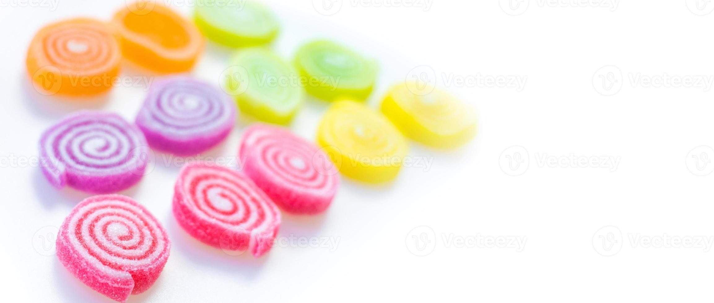 colorful sweets and sugar candies on a white background photo