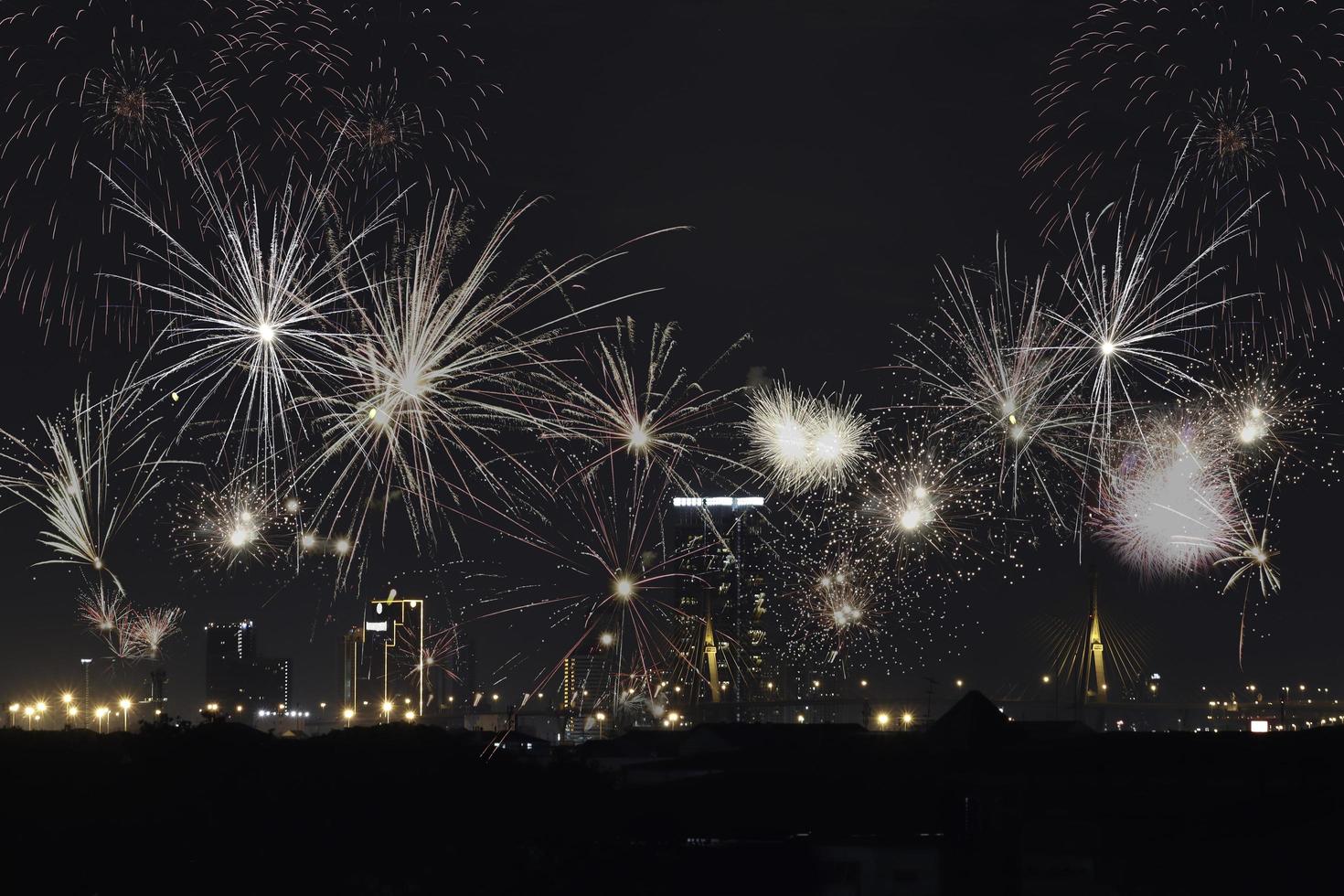Firework with cityscape night light city view, colorful fireworks display over skyscraper building architecture skyline horizon downtown at night photo