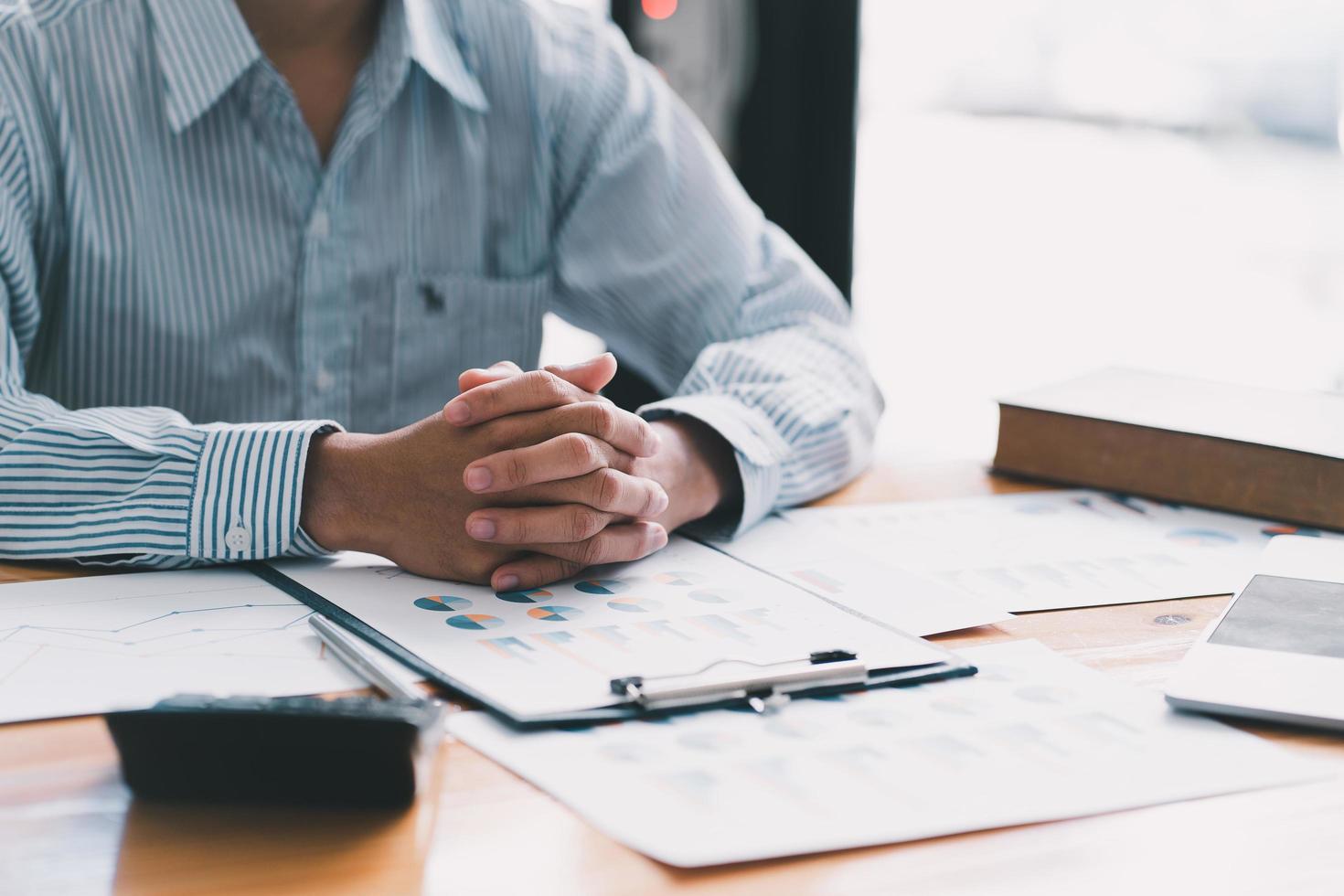 Financial businessman analyze the graph of the company's performance to create profits and growth, Market research reports and income statistics, Financial and Accounting concept. photo