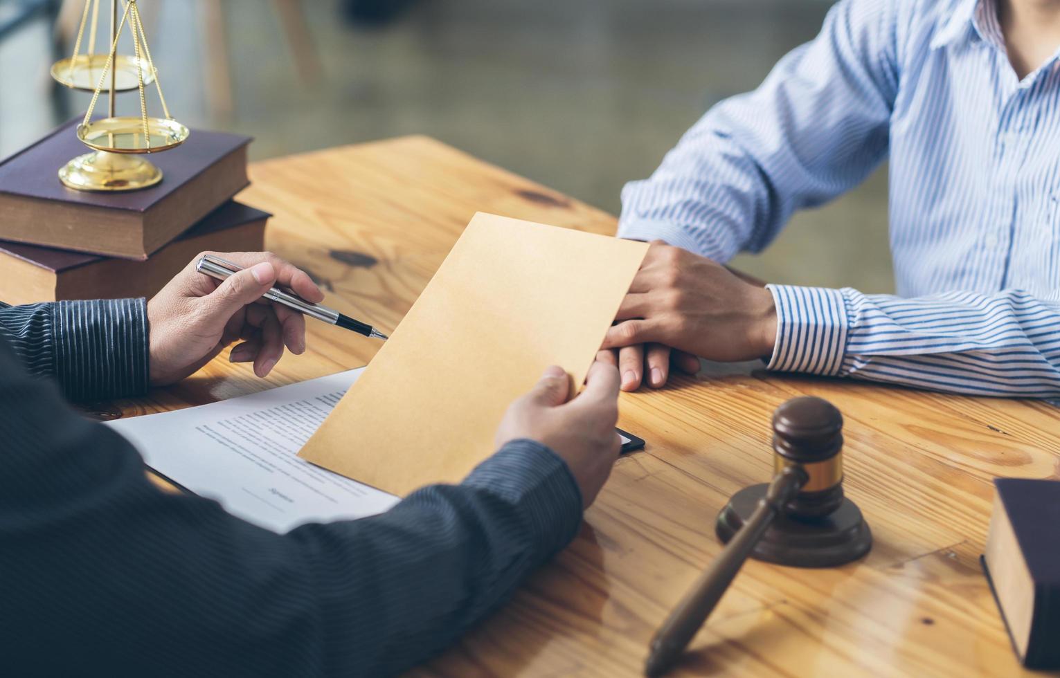 Businessman and lawyer discuss the contract document. Treaty of the law. Sign a contract business. lawyer concept. photo