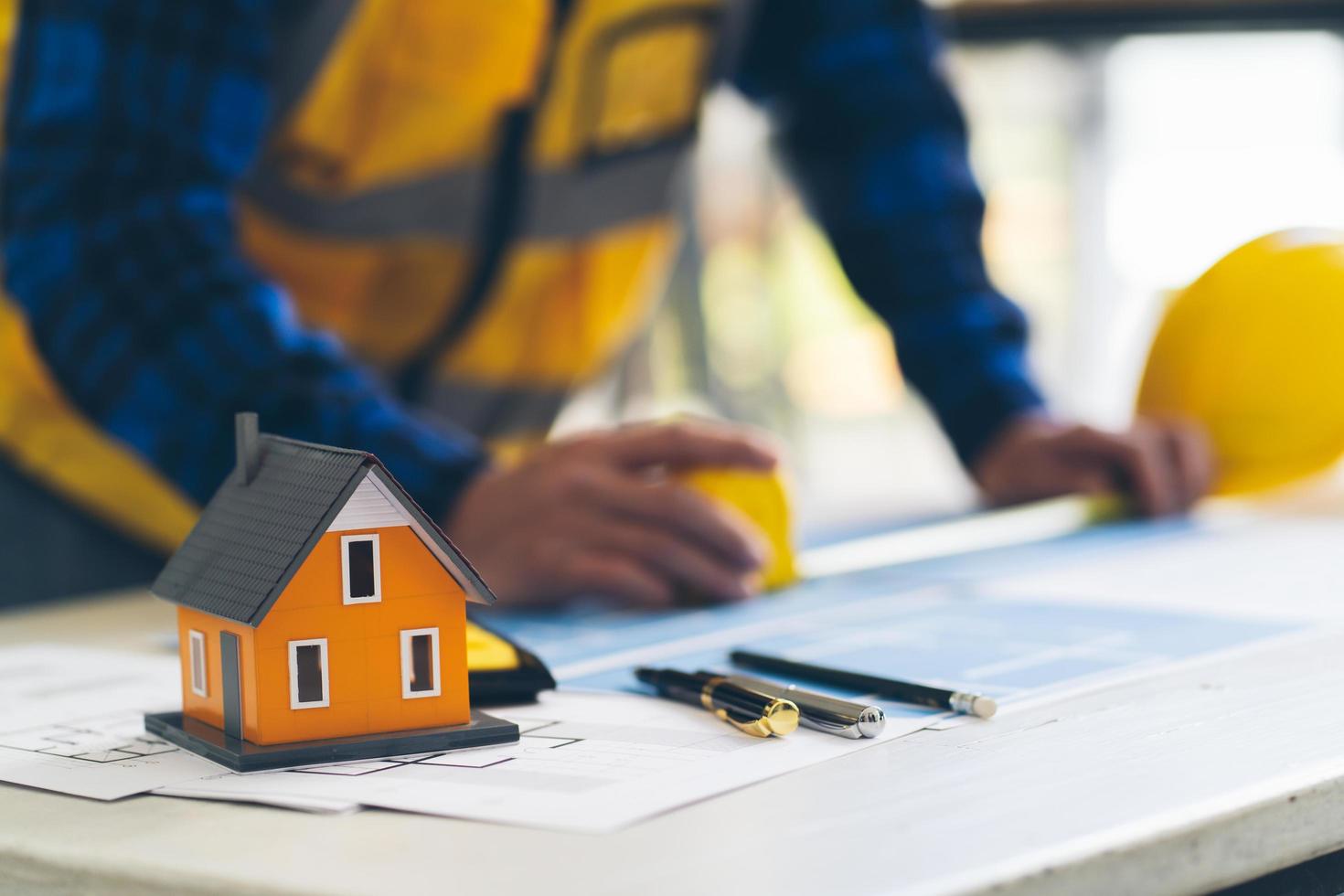 architect man working with blueprints,engineer inspection in workplace for architectural plan,sketching a construction project , architect and engineer concept. photo