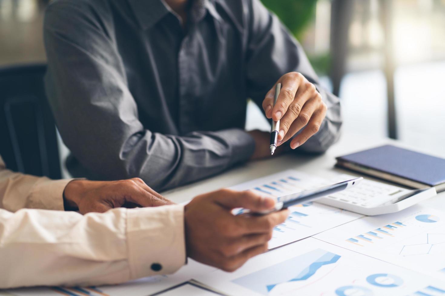 Administrator business man financial inspector and secretary making report, calculating balance. Internal Revenue Service checking document. Audit concept photo