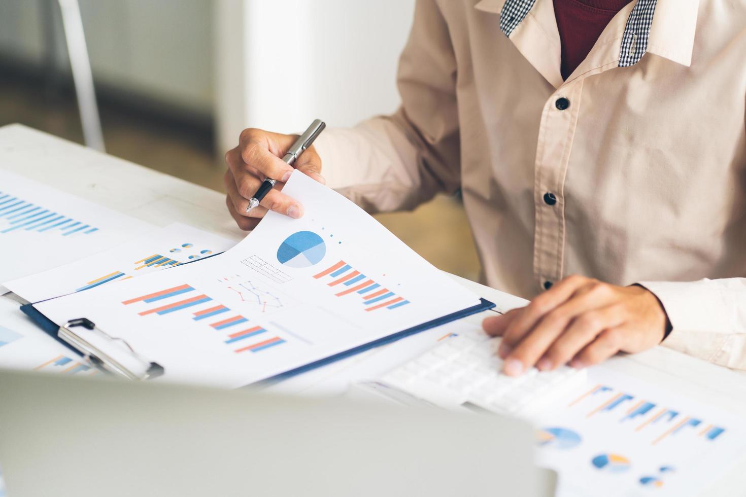 Business and finance concept, Business woman using calculator to calculate business data at office. photo