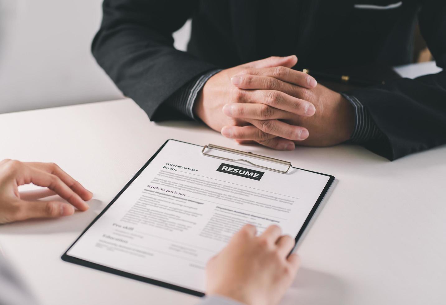 Close up diverse businessman hands talking at meeting. Client making deal with professional manager at negotiate in office. Successful man concludes agreement with lawyer. photo
