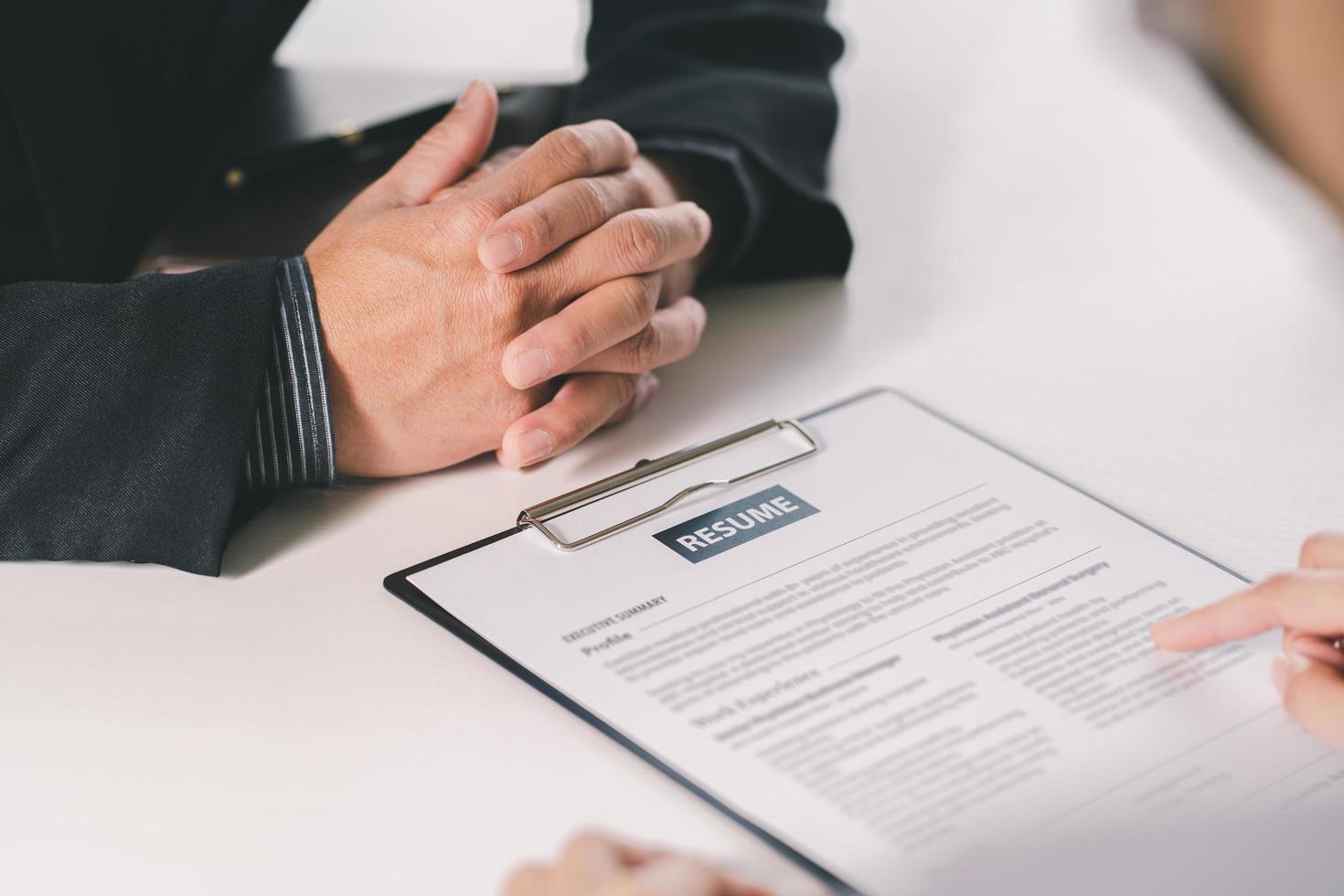 Close up diverse businessman hands talking at meeting. Client making deal with professional manager at negotiate in office. Successful man concludes agreement with lawyer. photo
