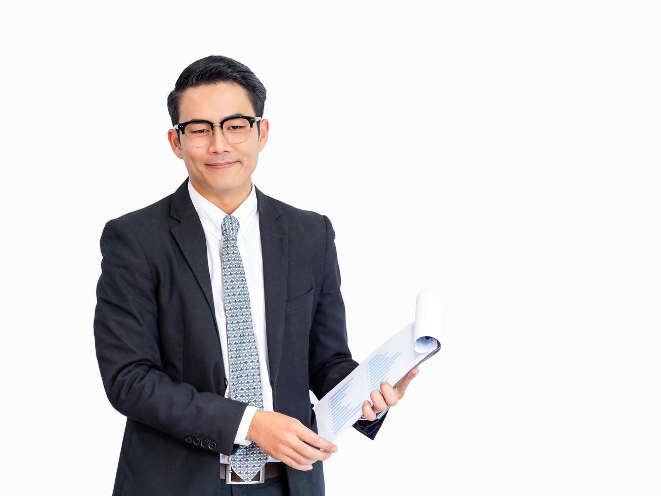 Young Asian businessmen present information about business statistics for use in business competition photo