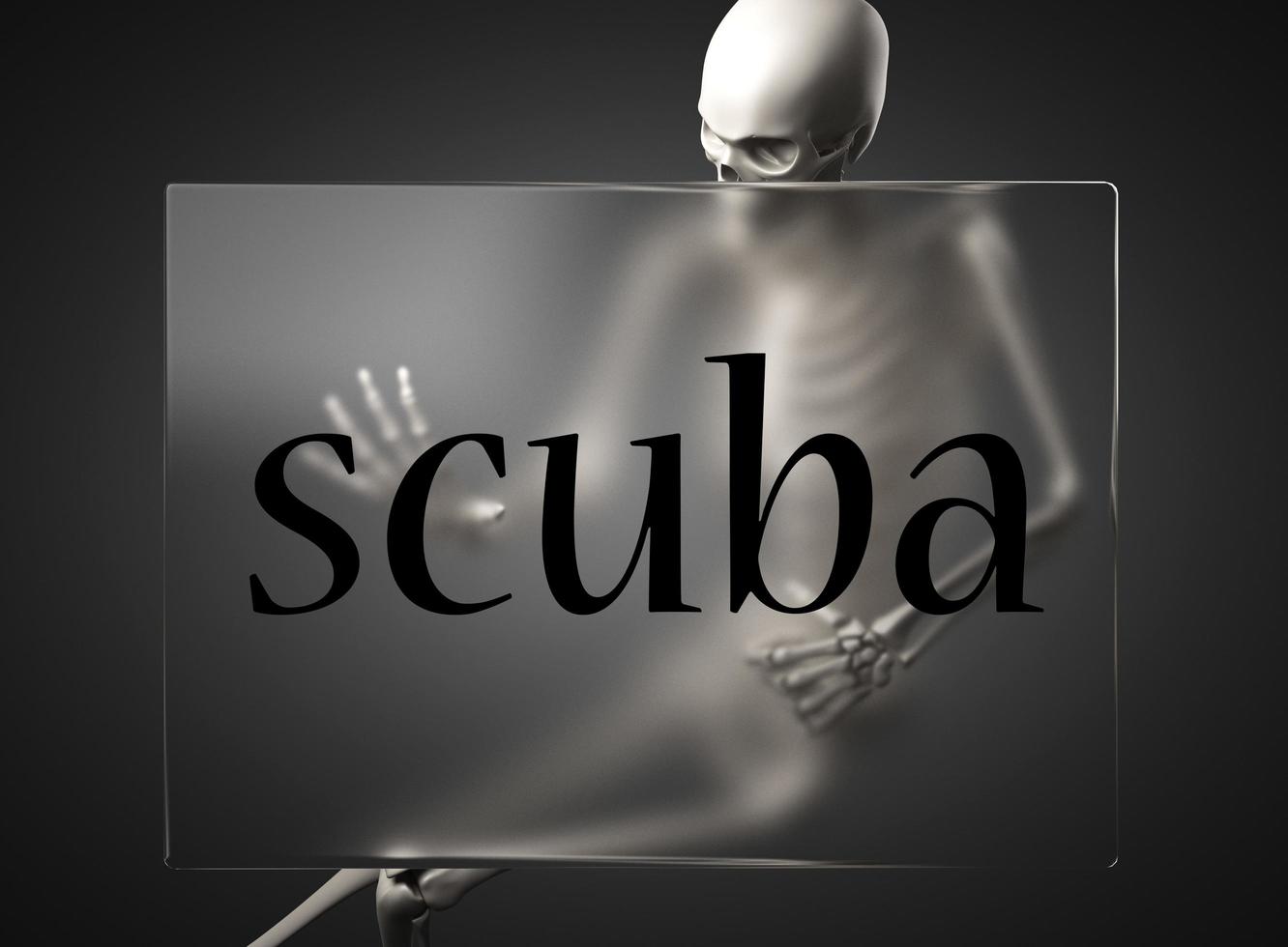 scuba word on glass and skeleton photo
