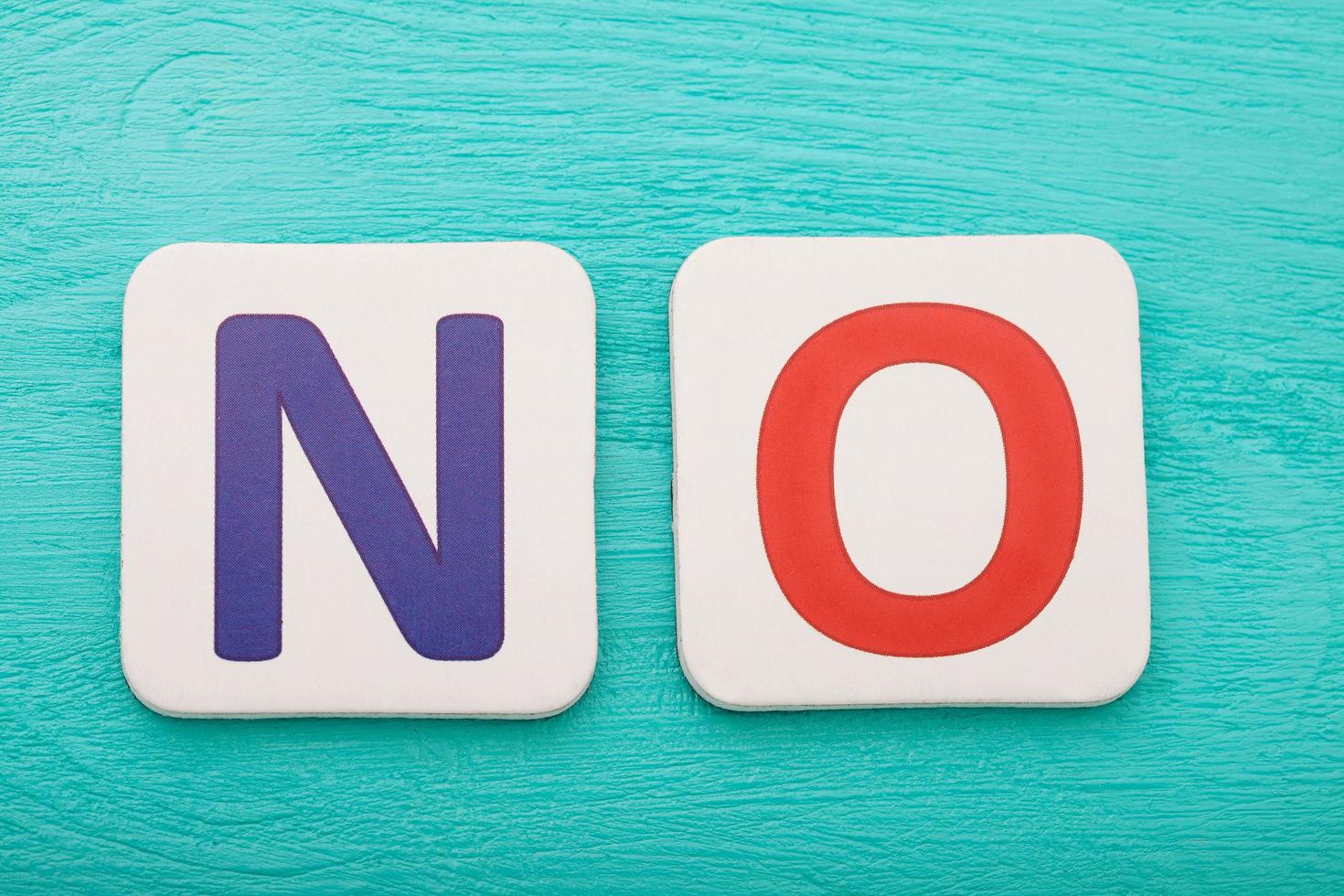 Word no on blue wooden background. Copy space. Top view. Mock up. photo
