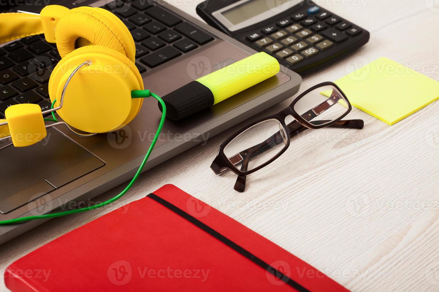 Creative workspace with work accessories and copy space on wooden table. Top view photo