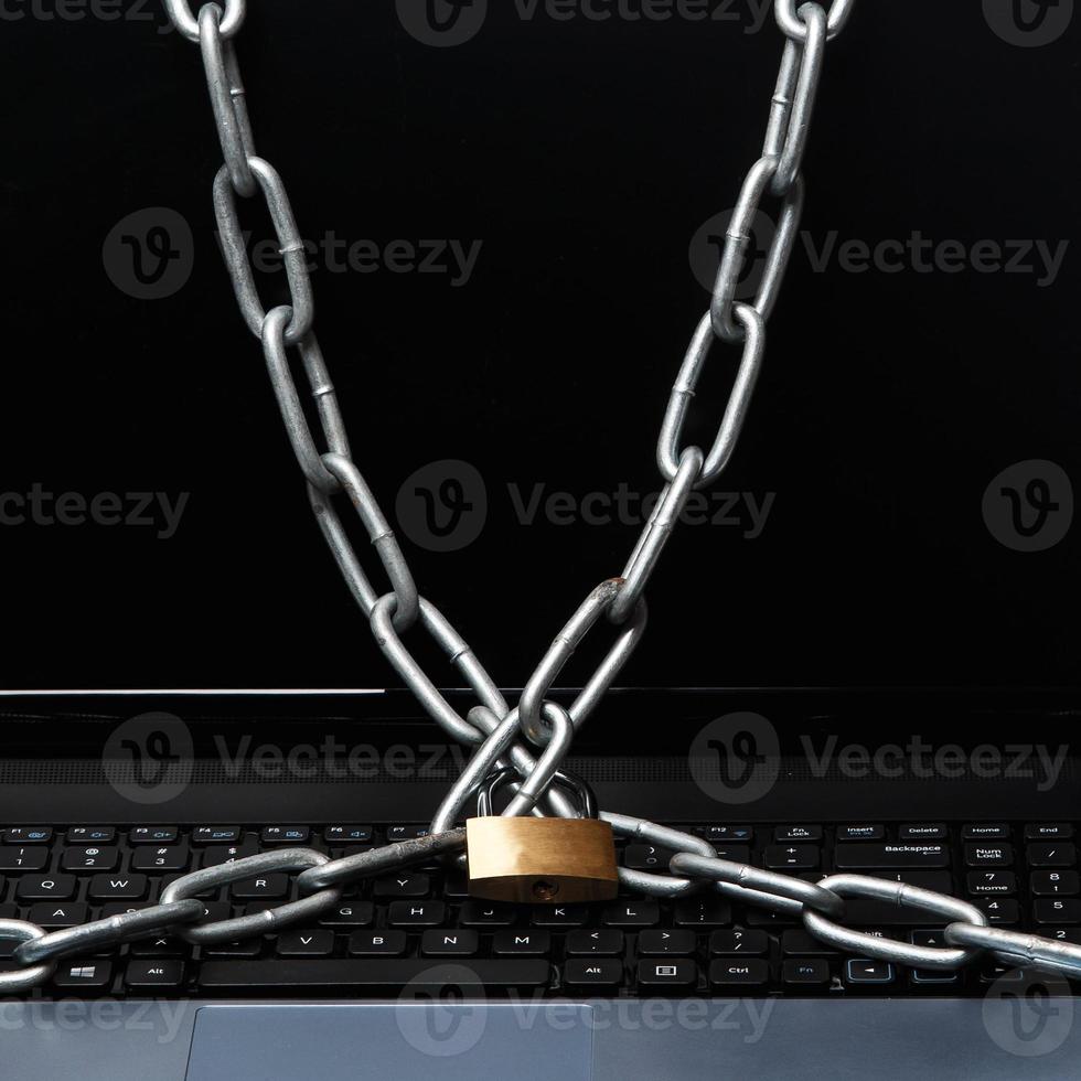 Padlock and chain on keyboard photo