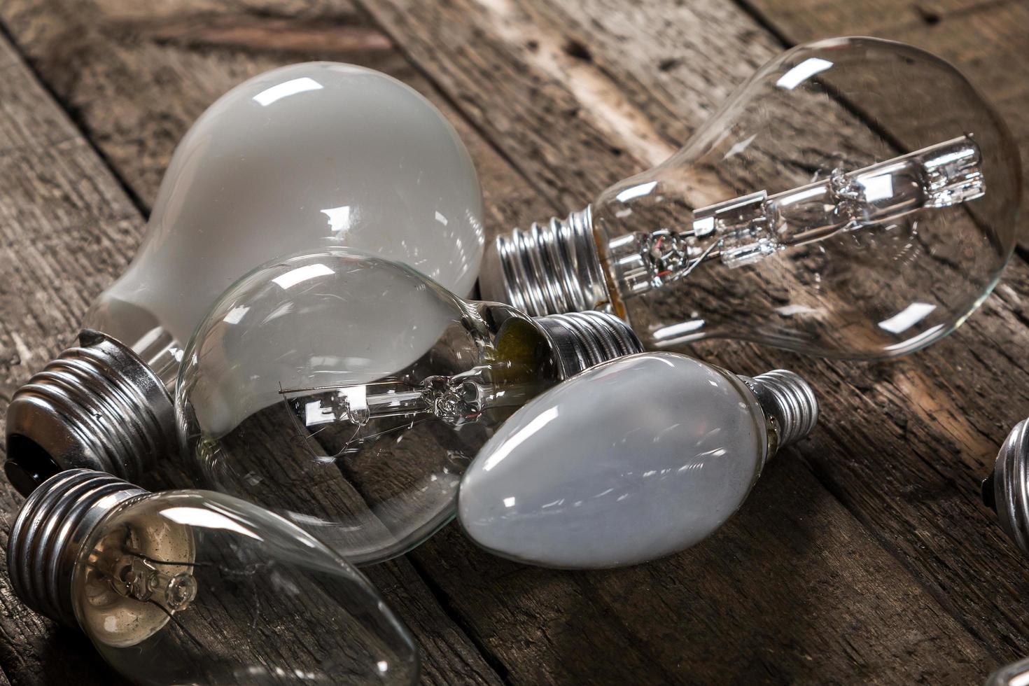 Lightbulbs on wooden background photo