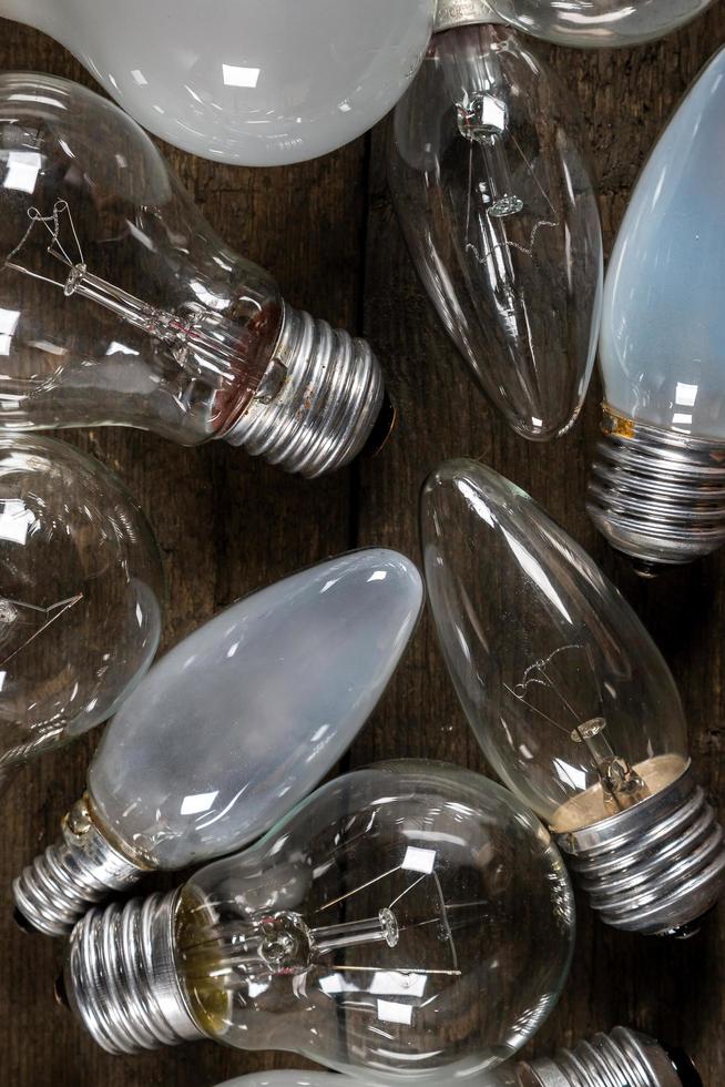 Lightbulbs on wooden background photo