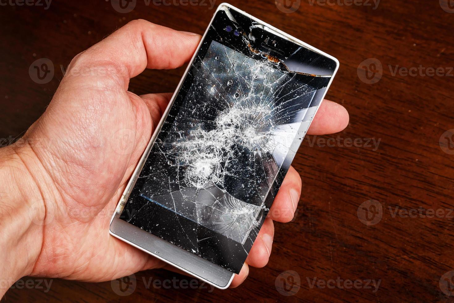 Smartphone with cracked display photo