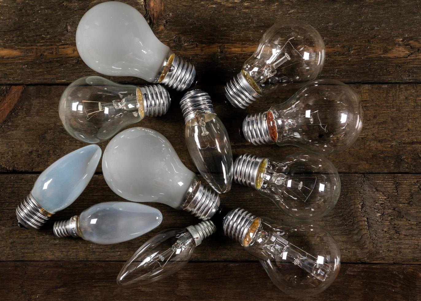 Lightbulbs on wooden background photo