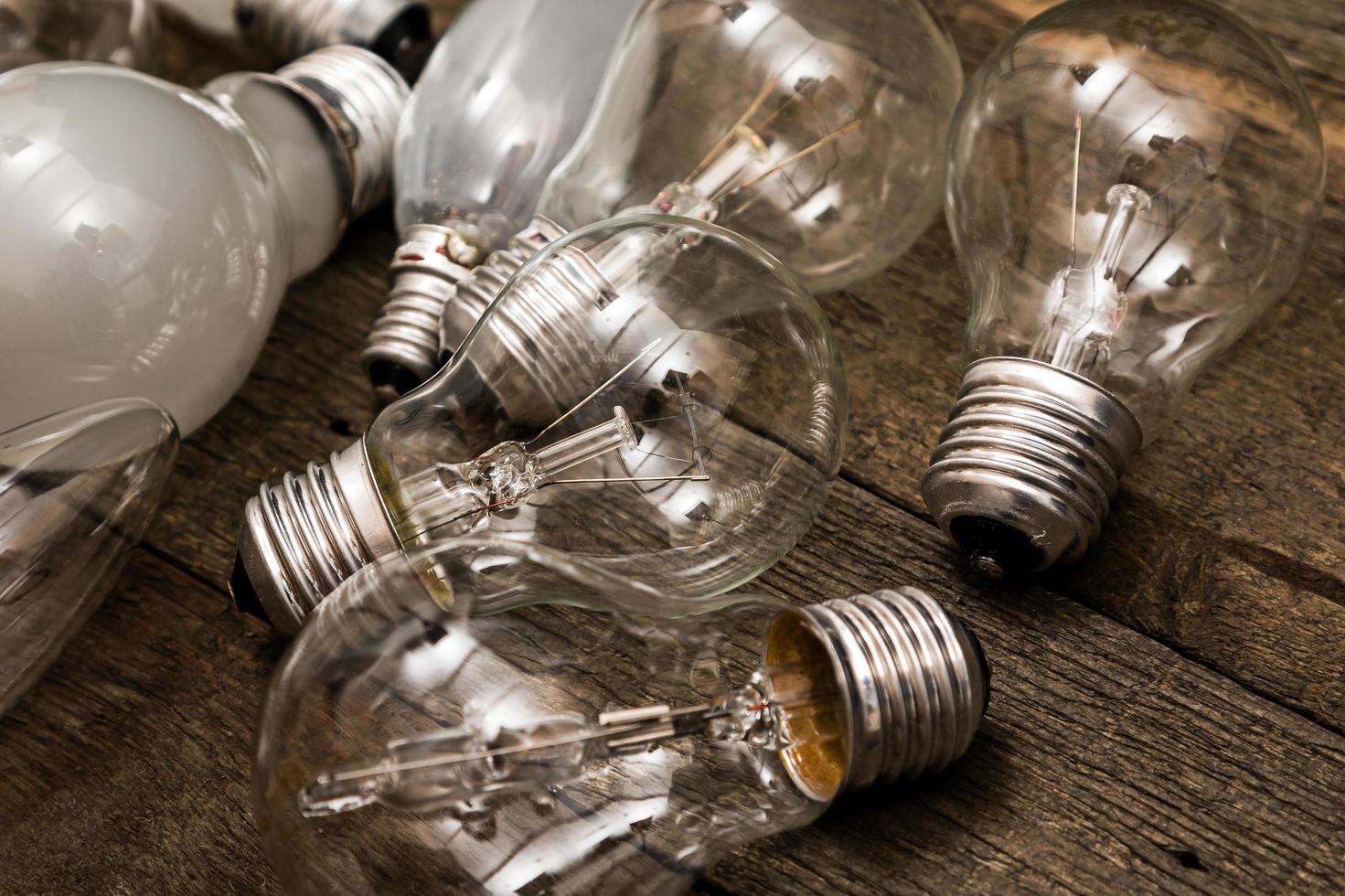 Lightbulbs on wooden background photo