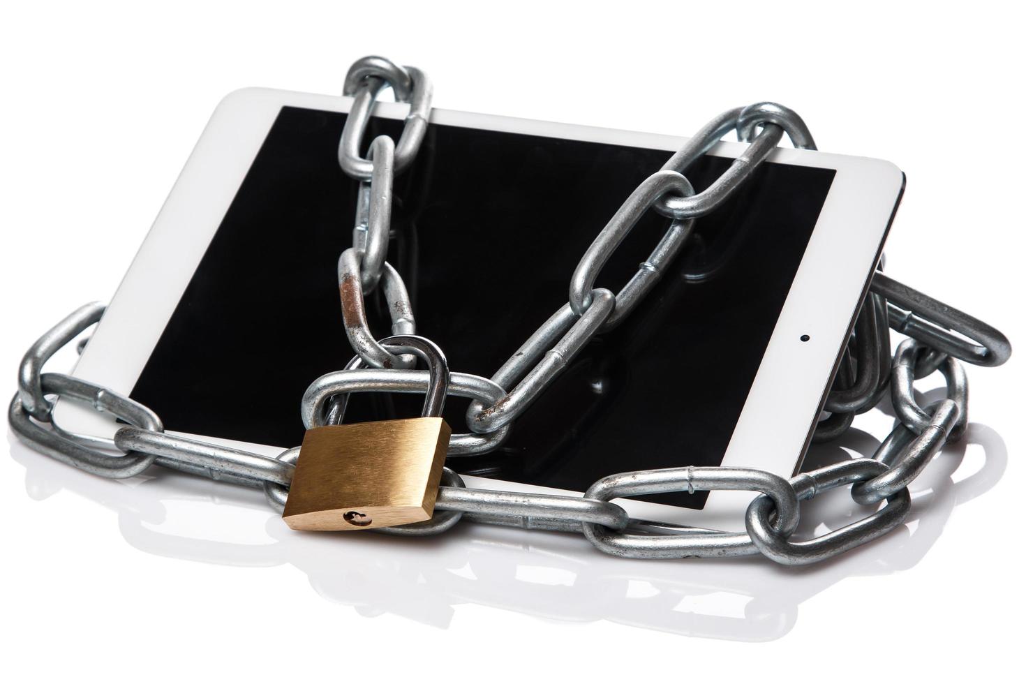 Tablet pc and padlock with chain photo