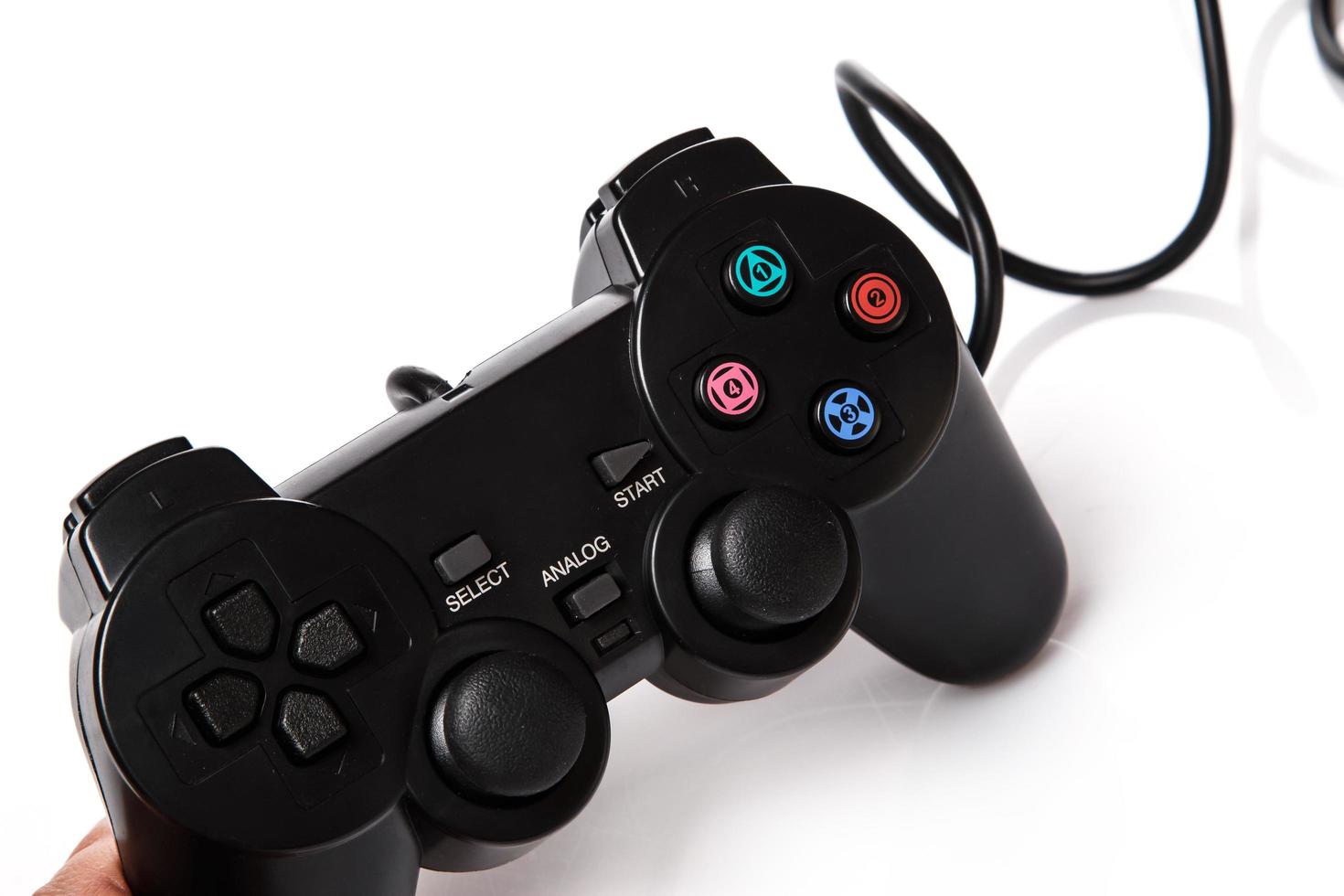 Black gamepad on white background photo