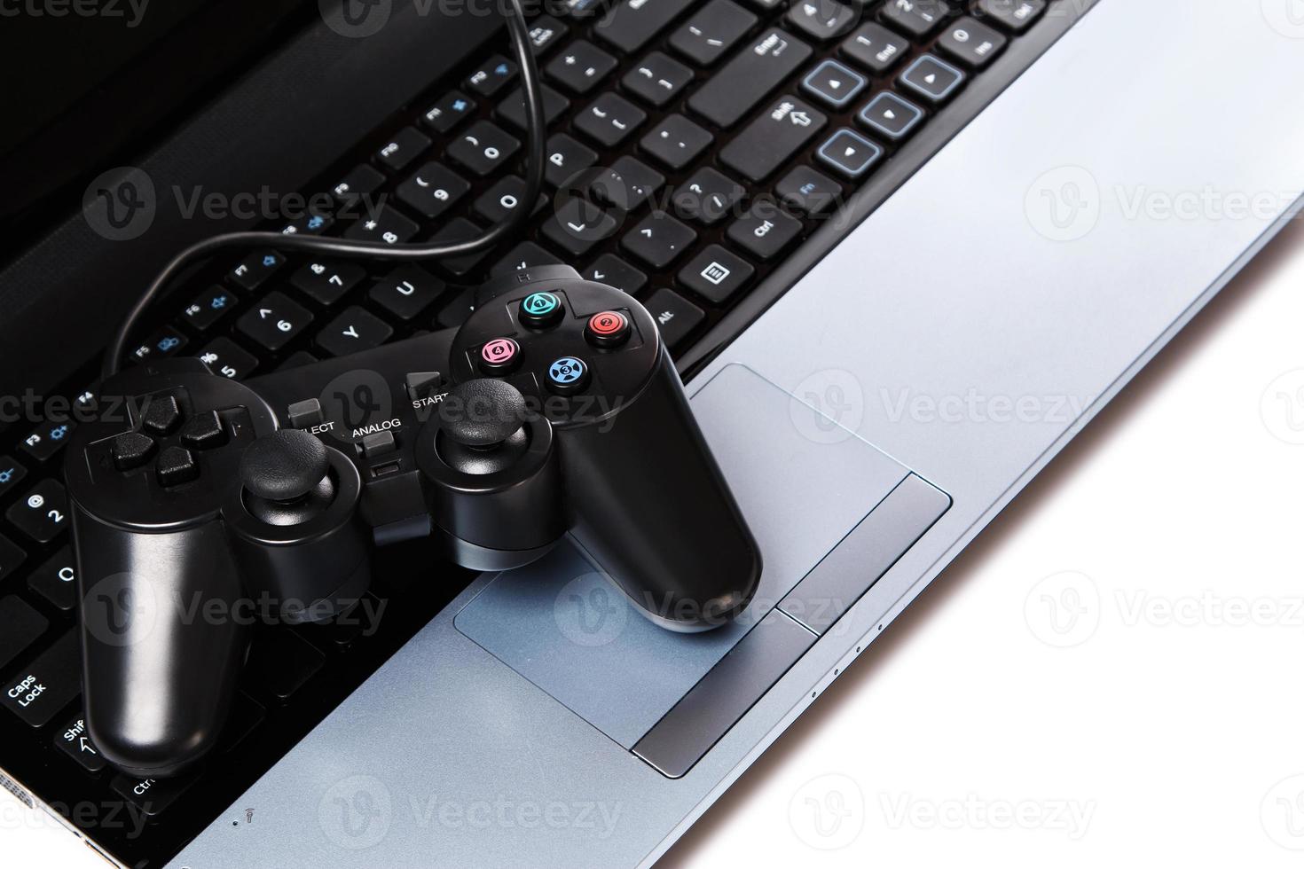 Gamepad is lying on a keyboard photo