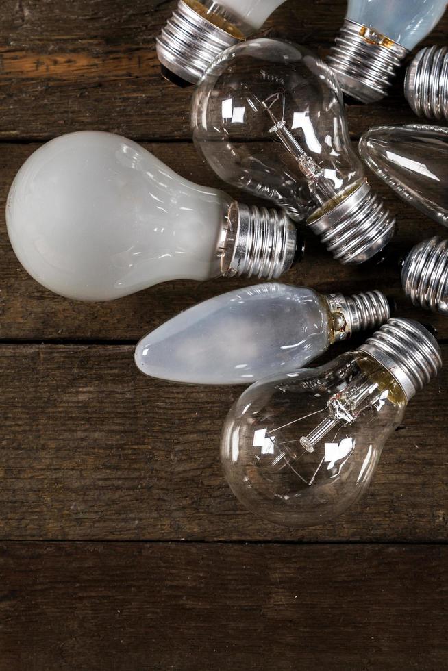 Lightbulbs on wooden background photo