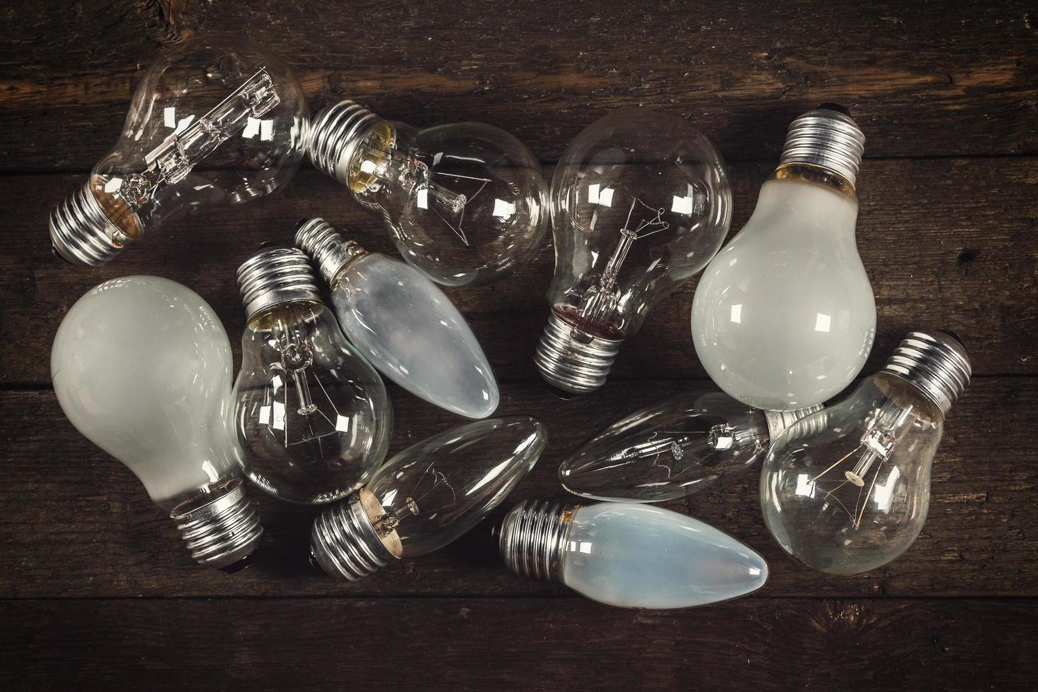 Lightbulbs on wooden background photo