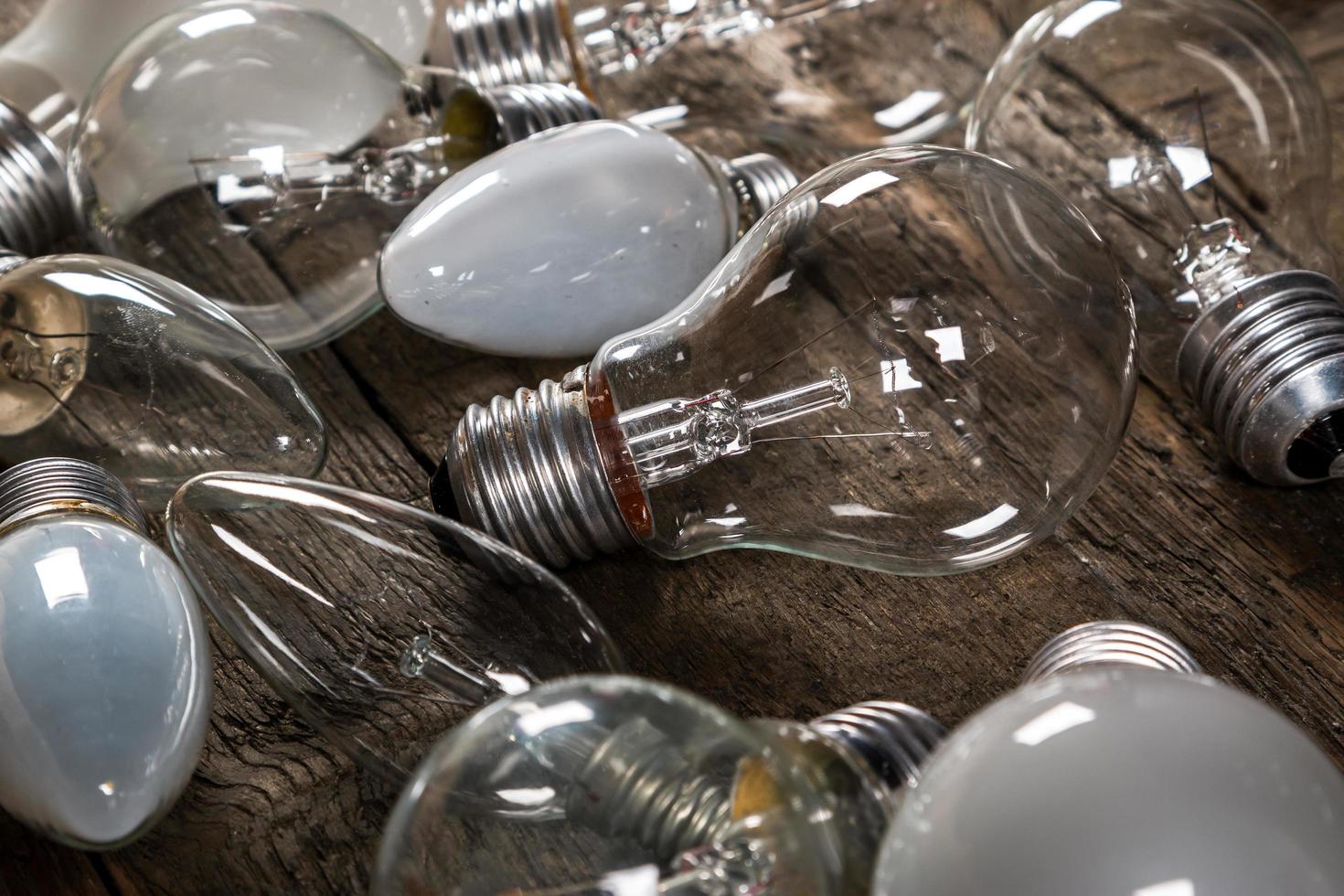 Lightbulbs on wooden background photo