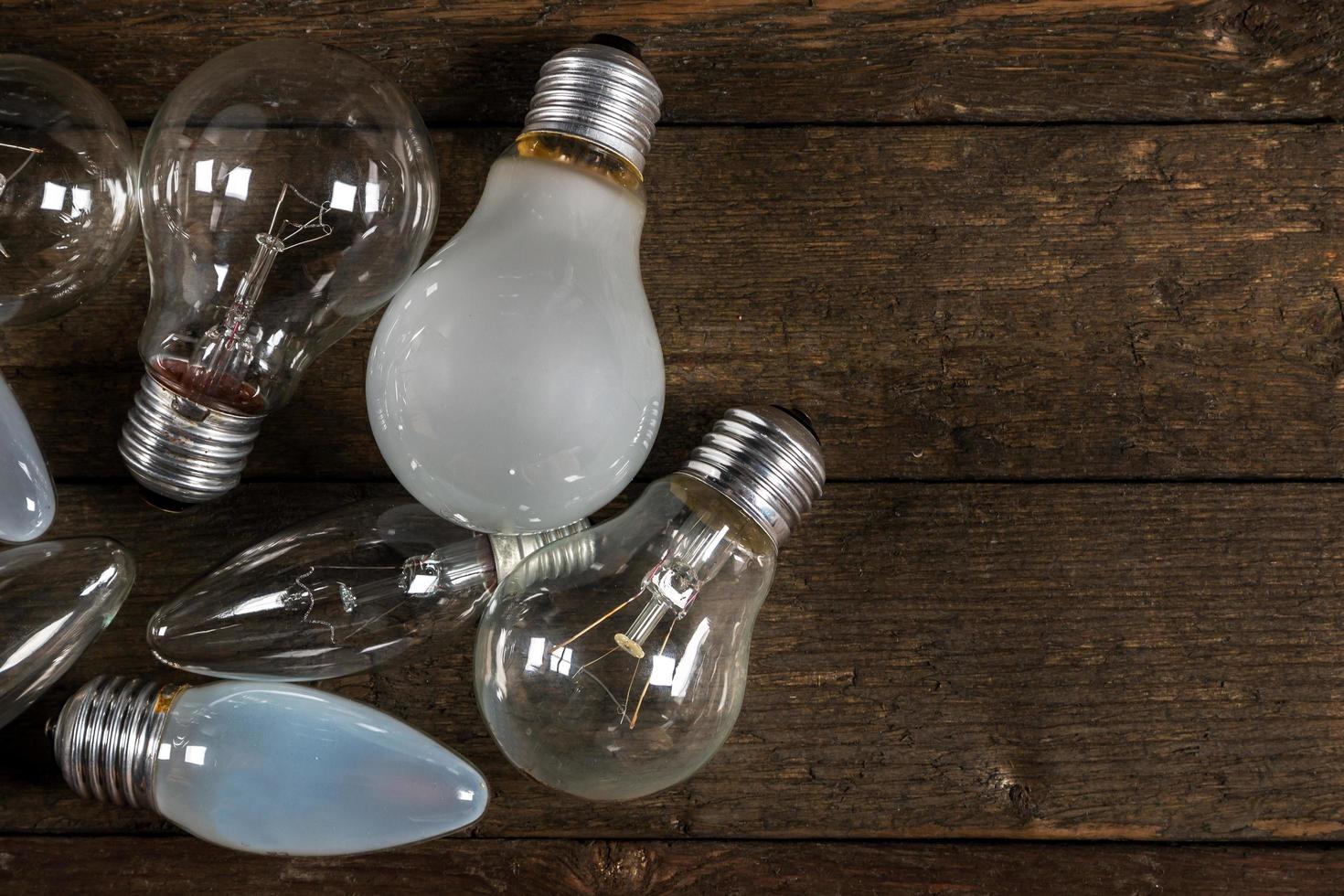 Lightbulbs on wooden background photo