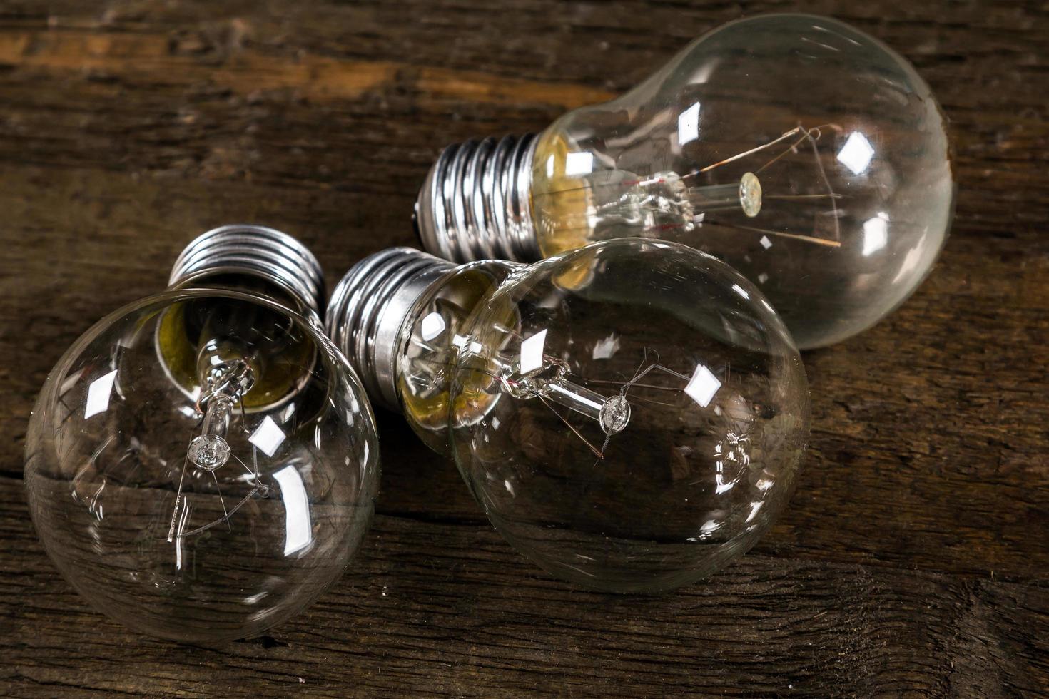 Lightbulbs on wooden background photo