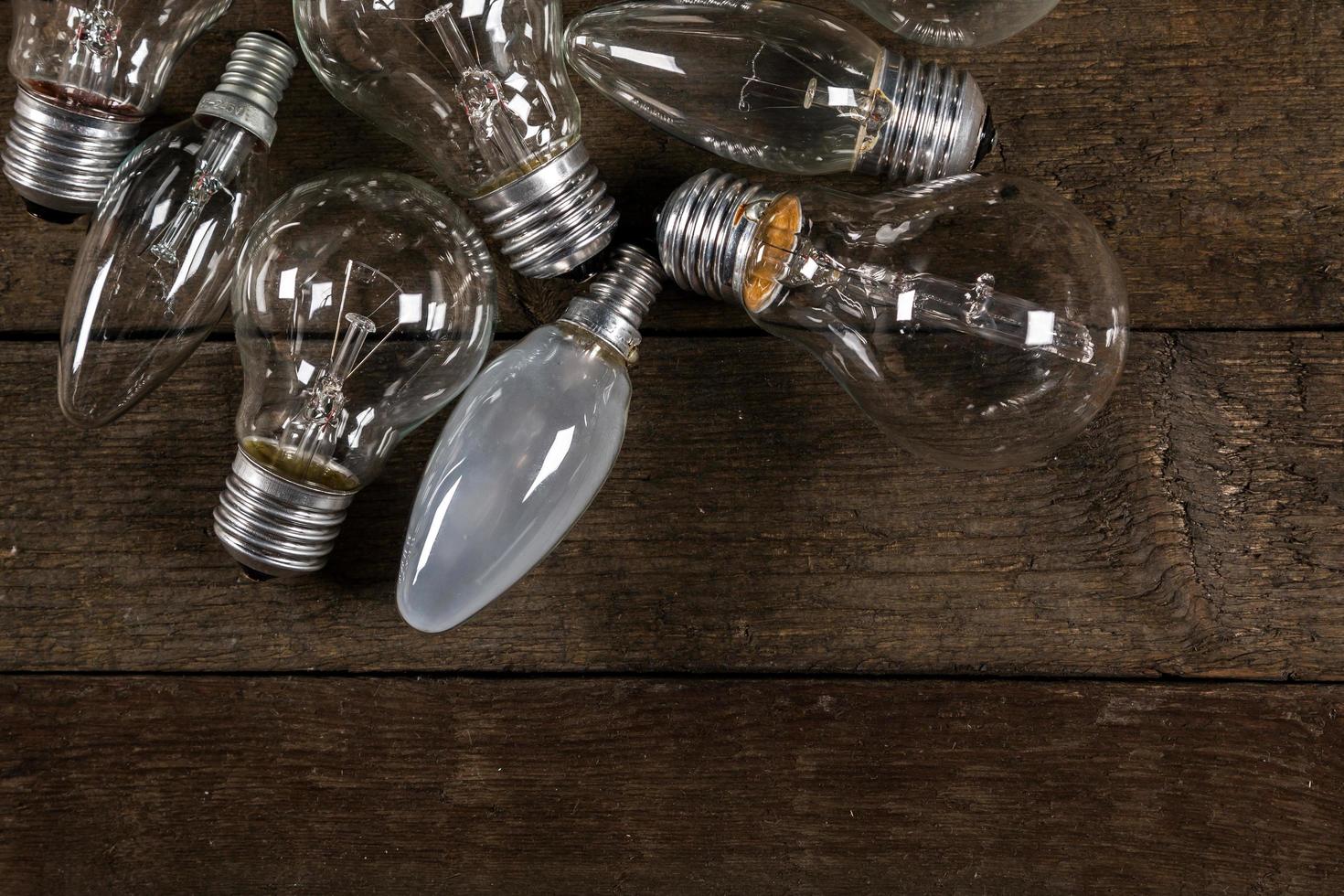 Lightbulbs on wooden background photo