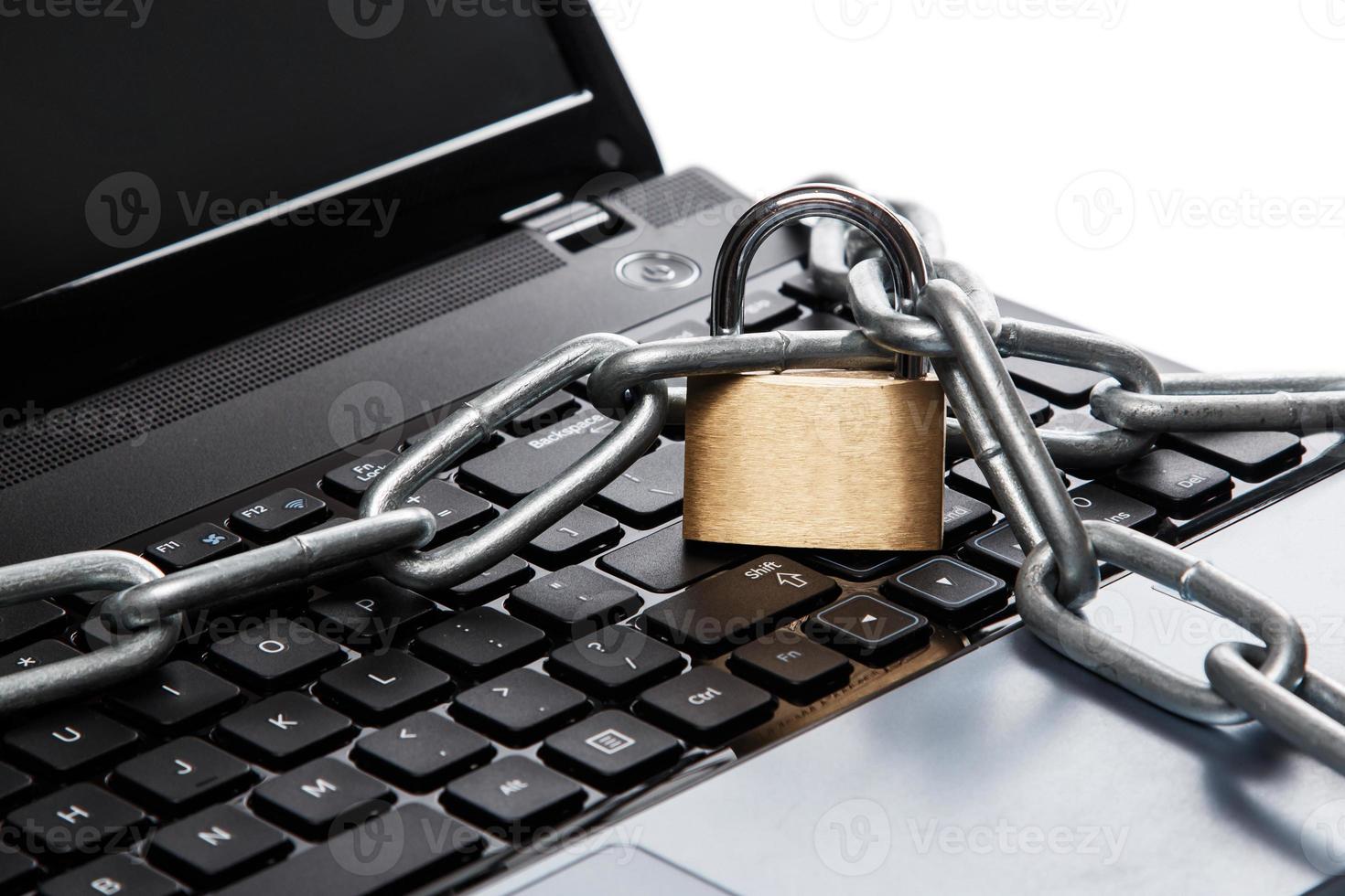 Padlock and chain on keyboard photo