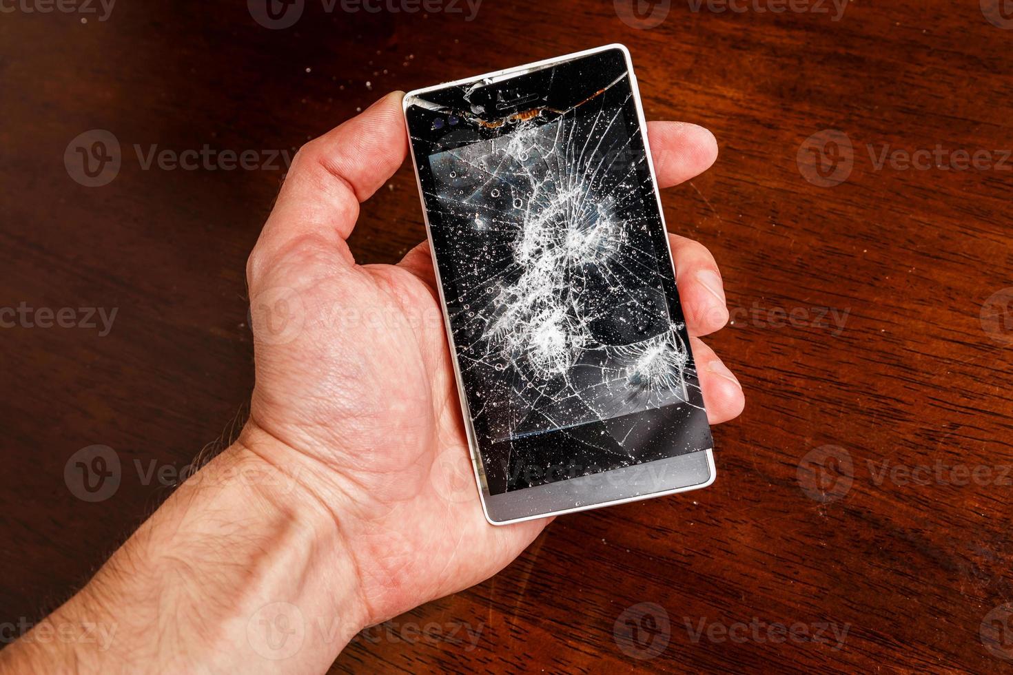 Smartphone with cracked display photo