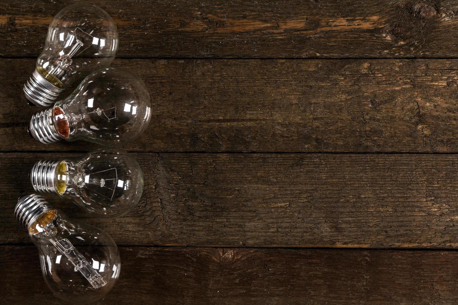 Lightbulbs on wooden background photo