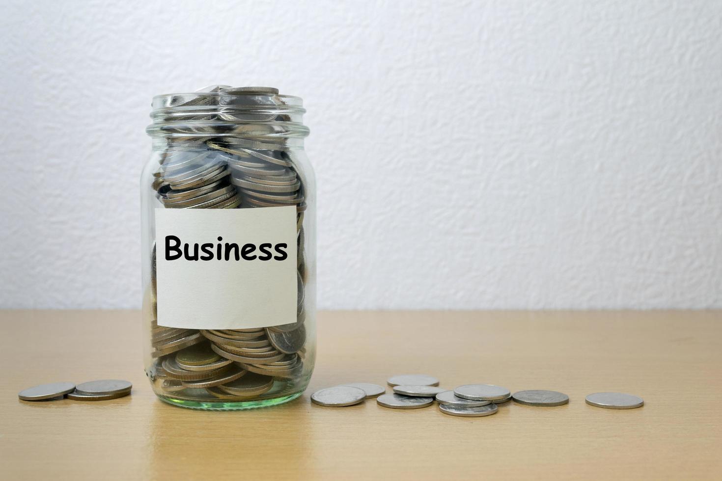 Money saving for business in the glass bottle photo