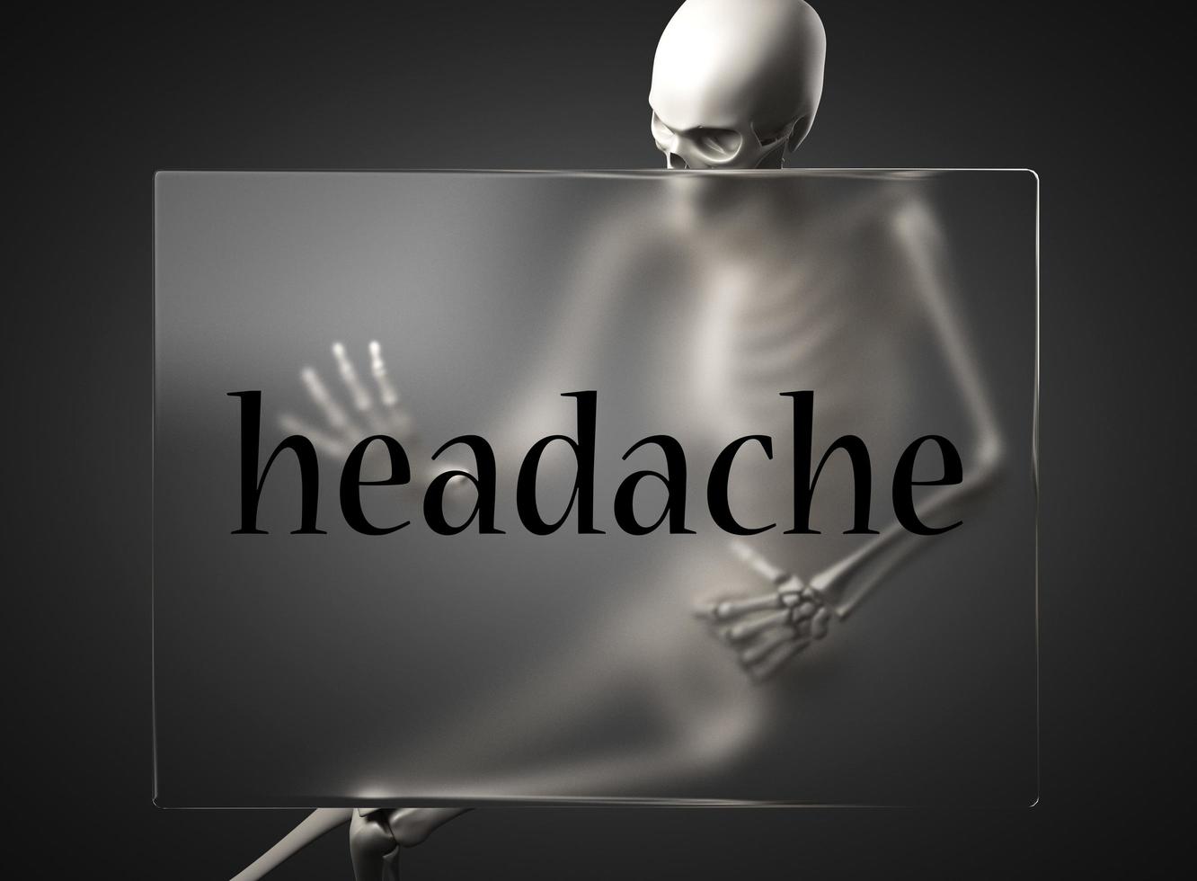 palabra de dolor de cabeza en vidrio y esqueleto foto