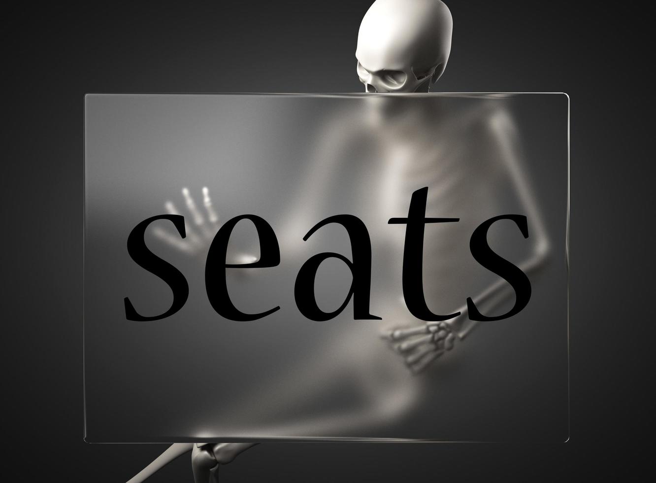palabra de asientos sobre vidrio y esqueleto foto