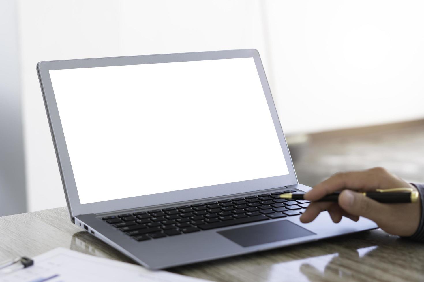 Man using laptop blank screen while sitting in office. photo