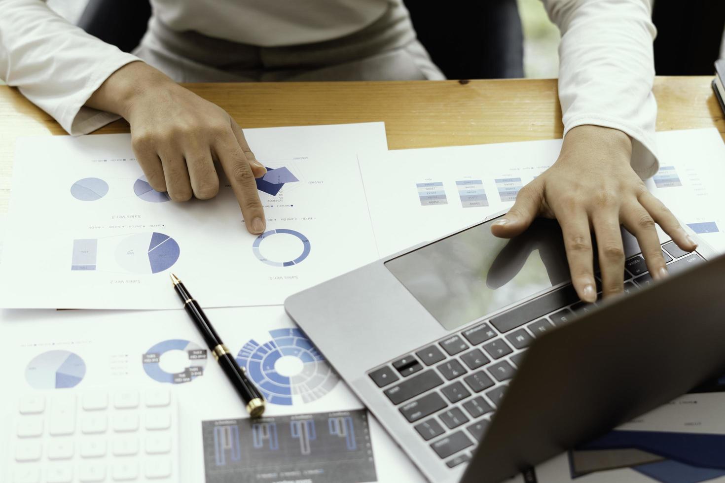strategy analysis concept, Businessman working financial Manager Researching Process accounting calculate analyse market graph data stock information review on the table in office. photo