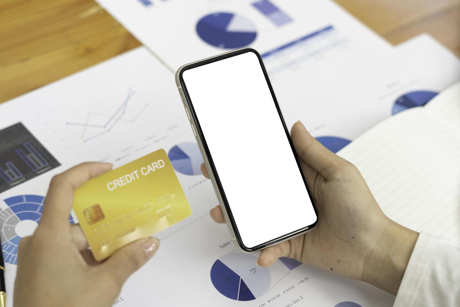 Top view Mockup image hand using a smartphone man Holding Cell Phone With Blank Screen photo