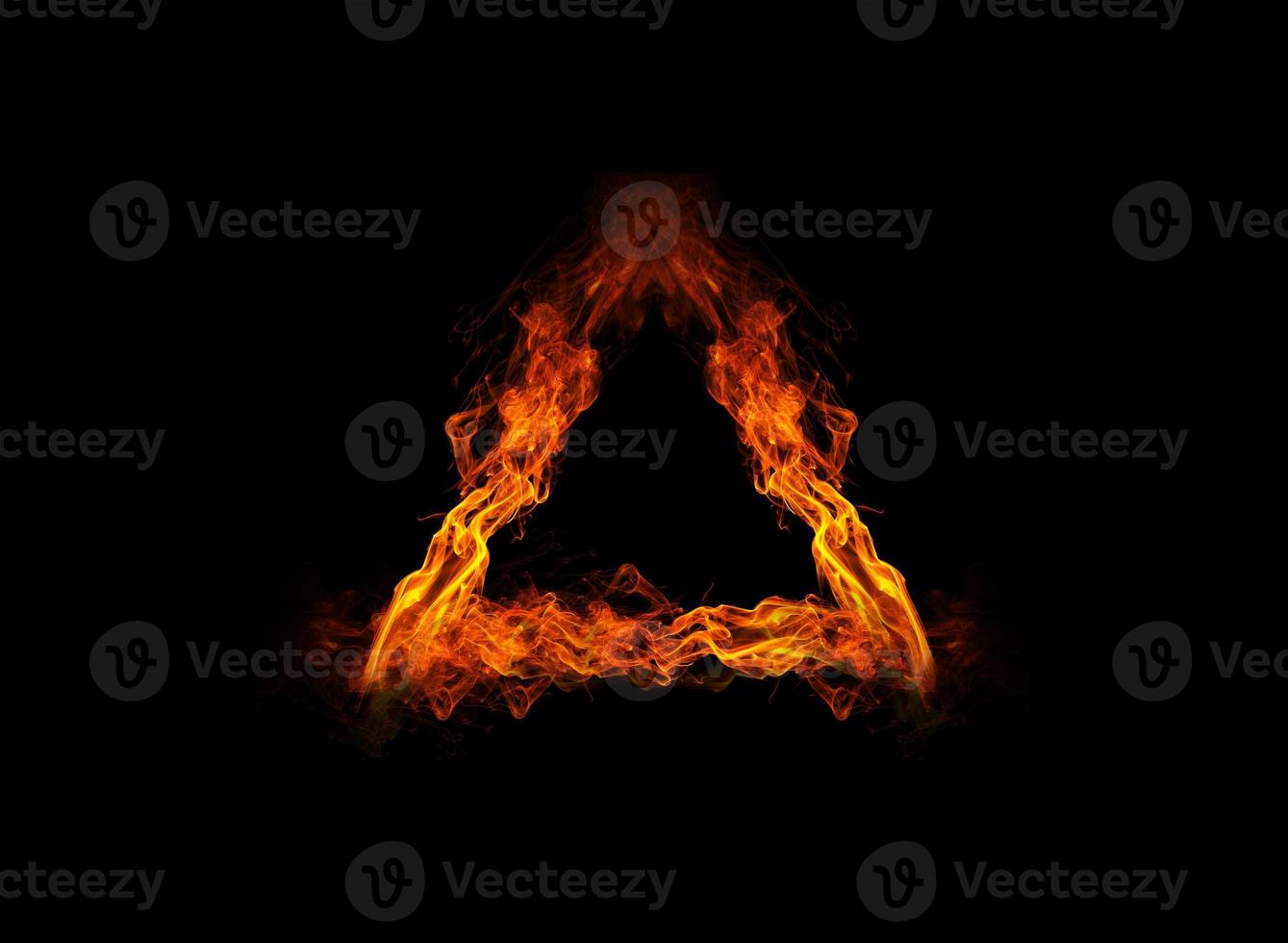 Triangle sign consisting of burning flame photo