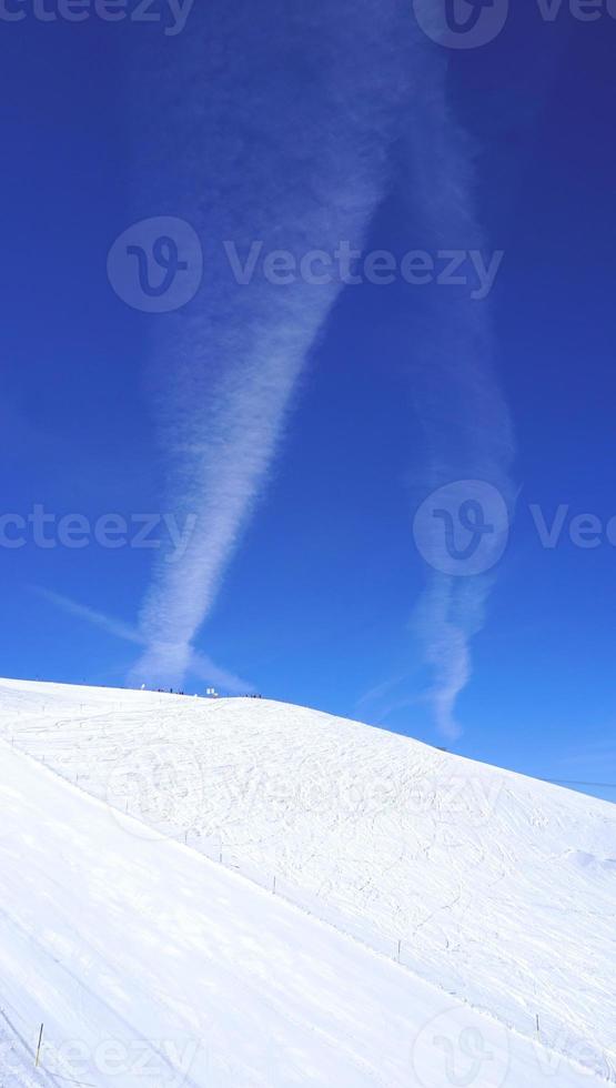 snow mountains Titlis and blue sky photo