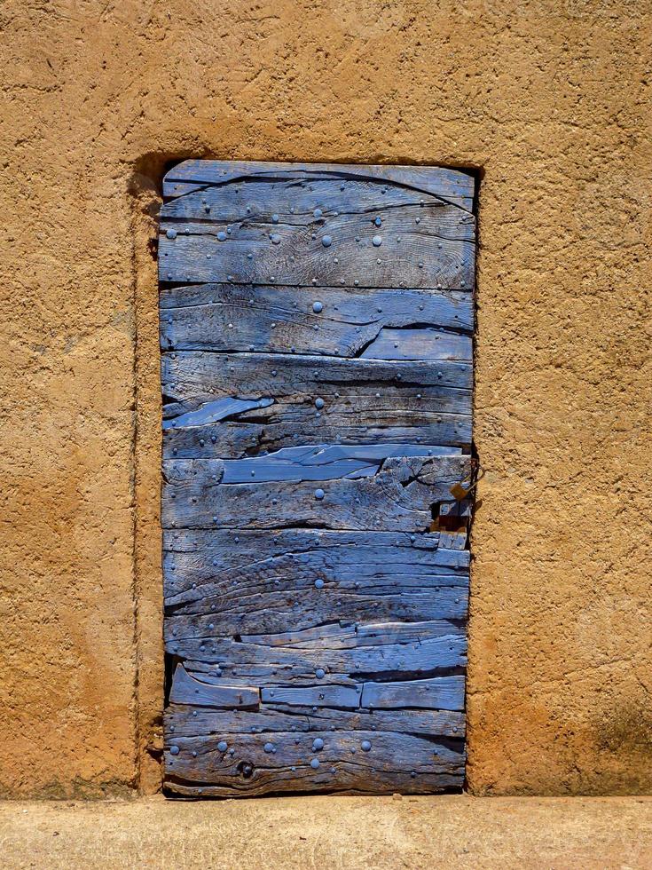 ertical shot of an old wooden door photo