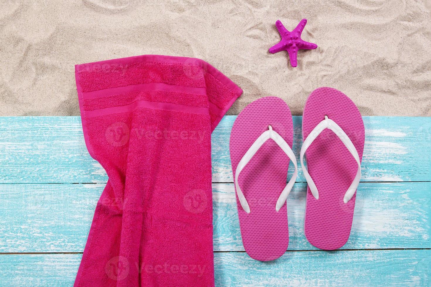 Sand copy space. Sand background top view.Beach towel, beach slippers and starfish photo