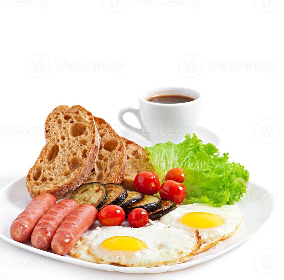 English breakfast - fried eggs, sausages, eggplant and tomatoes photo