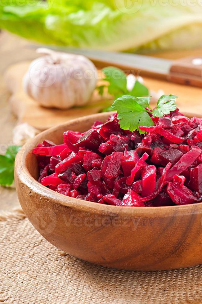 Beet salad Vinaigrette in a wooden bowl photo