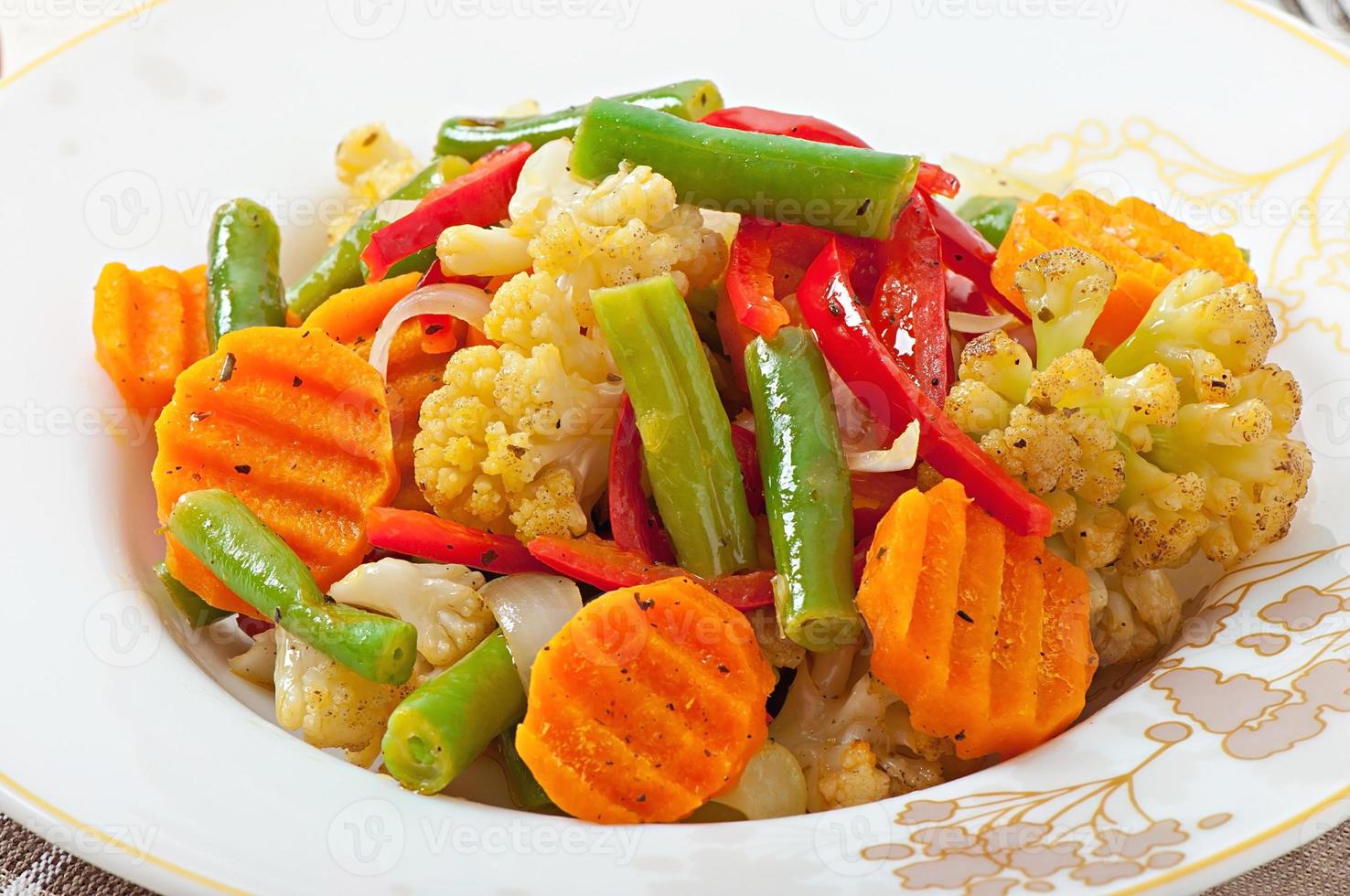 Steamed vegetables - cauliflower, green beans, carrots and onions photo
