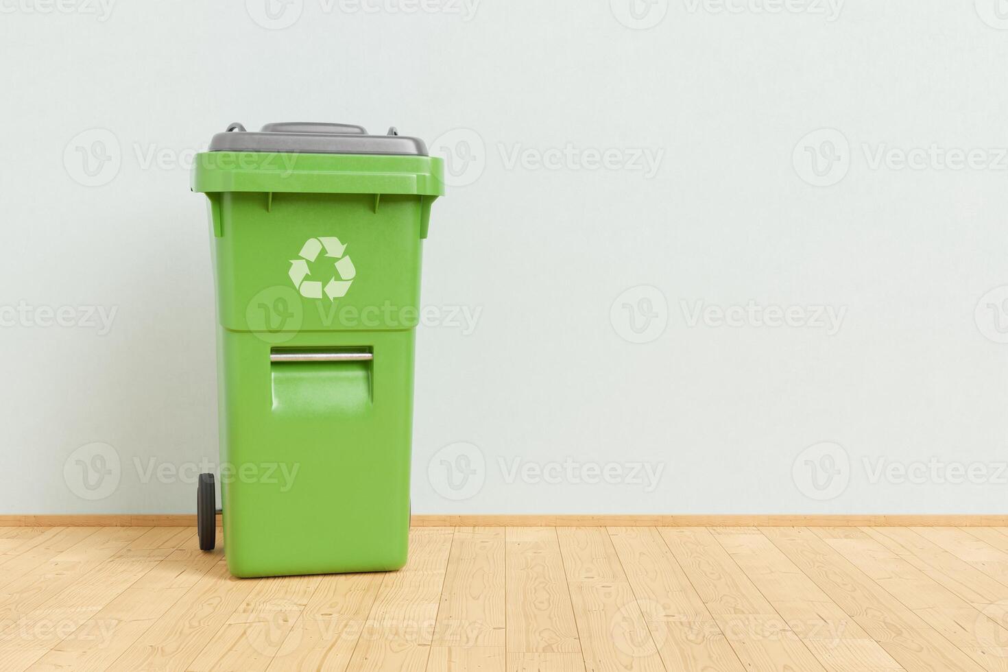 Recycling bin placed near wall photo