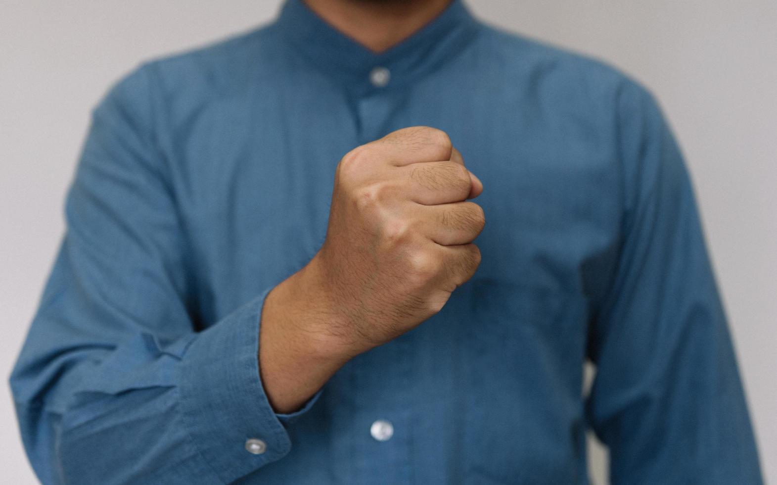 Young handsome man wearing light blue shirt  with different behaviors at work photo