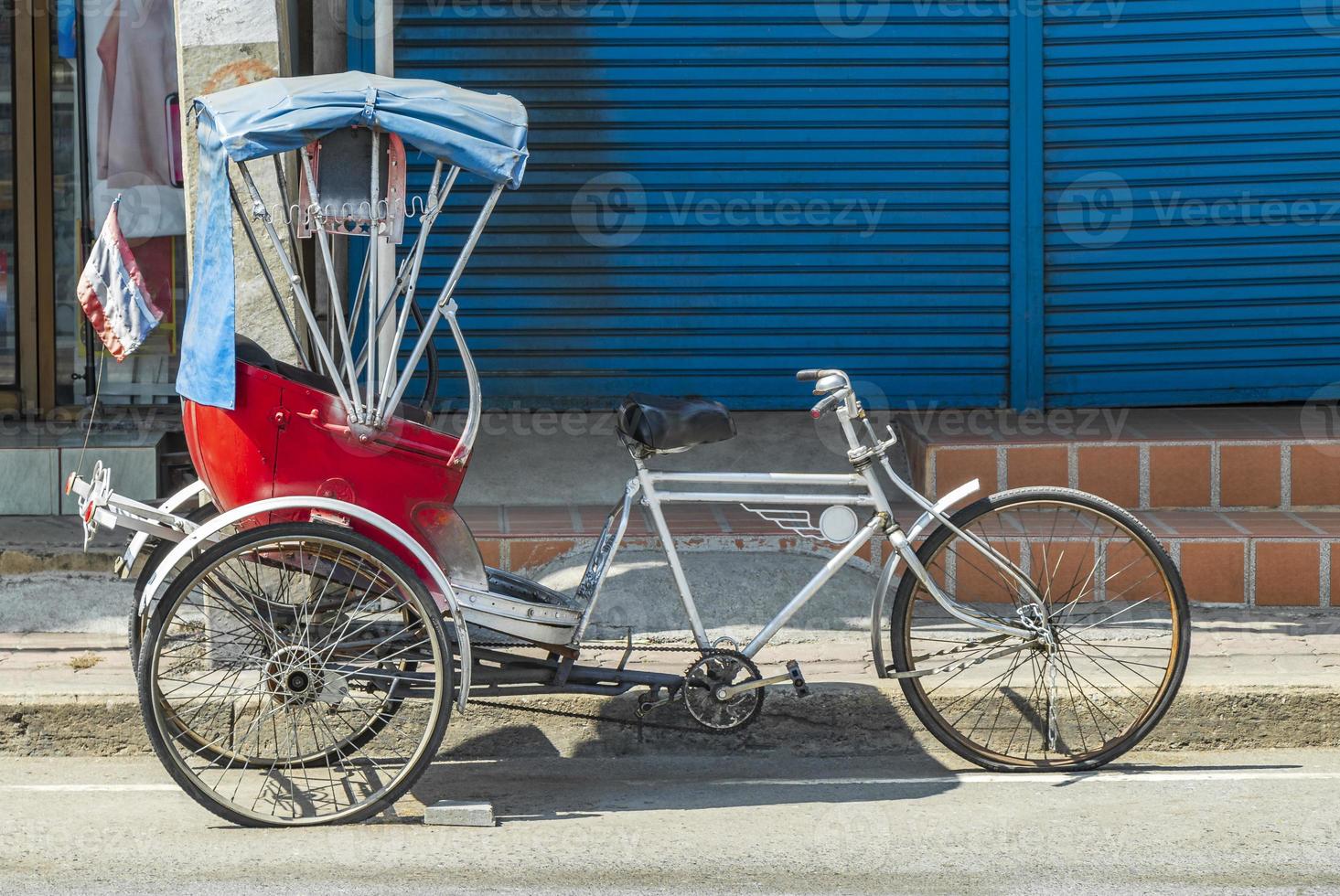 Old bike rickshaw rikshaw trishaw in Don Mueang Bangkok Thailand. photo