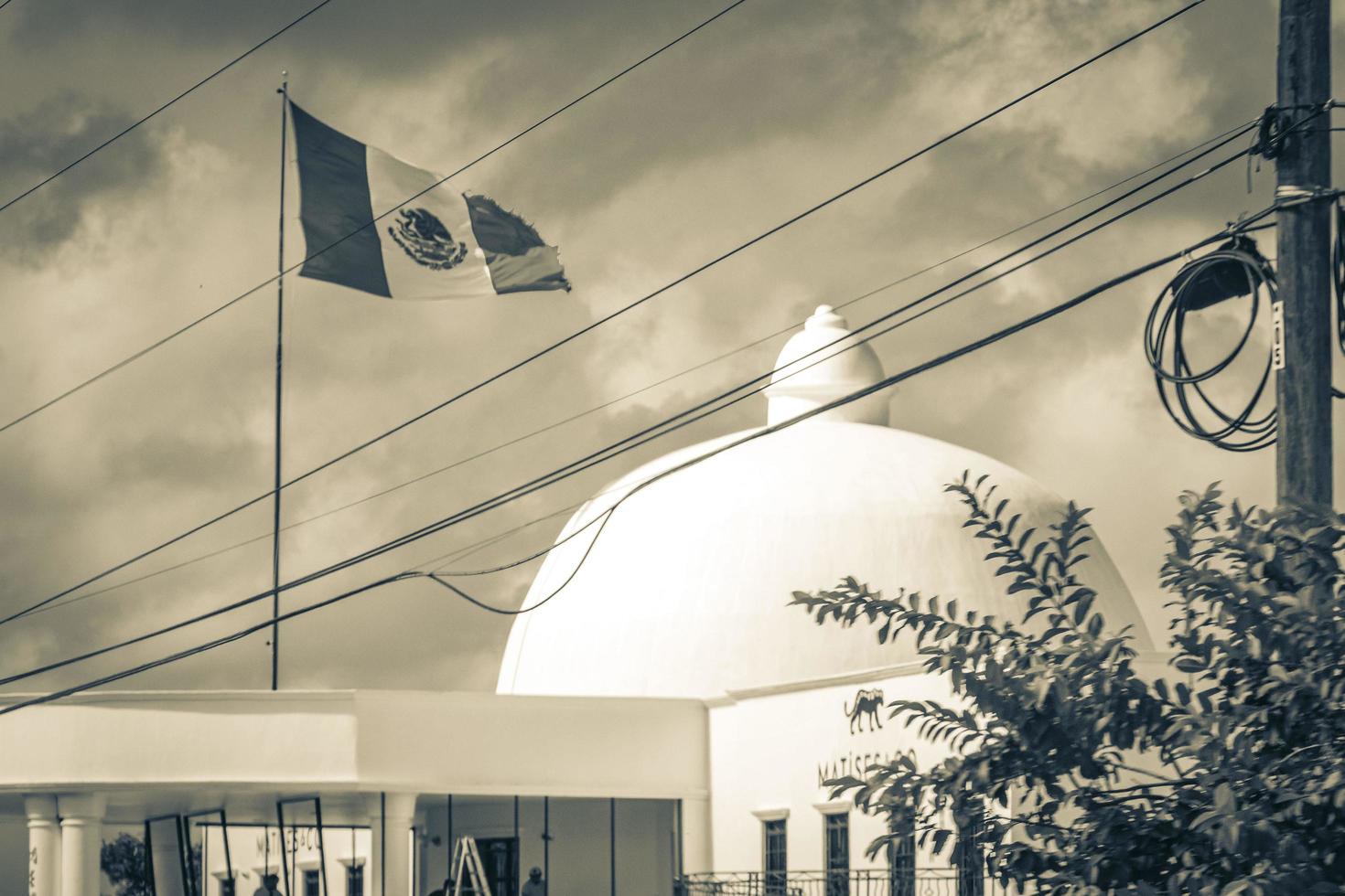 Mexican green white red flag at building Puerto Aventuras Mexico. photo