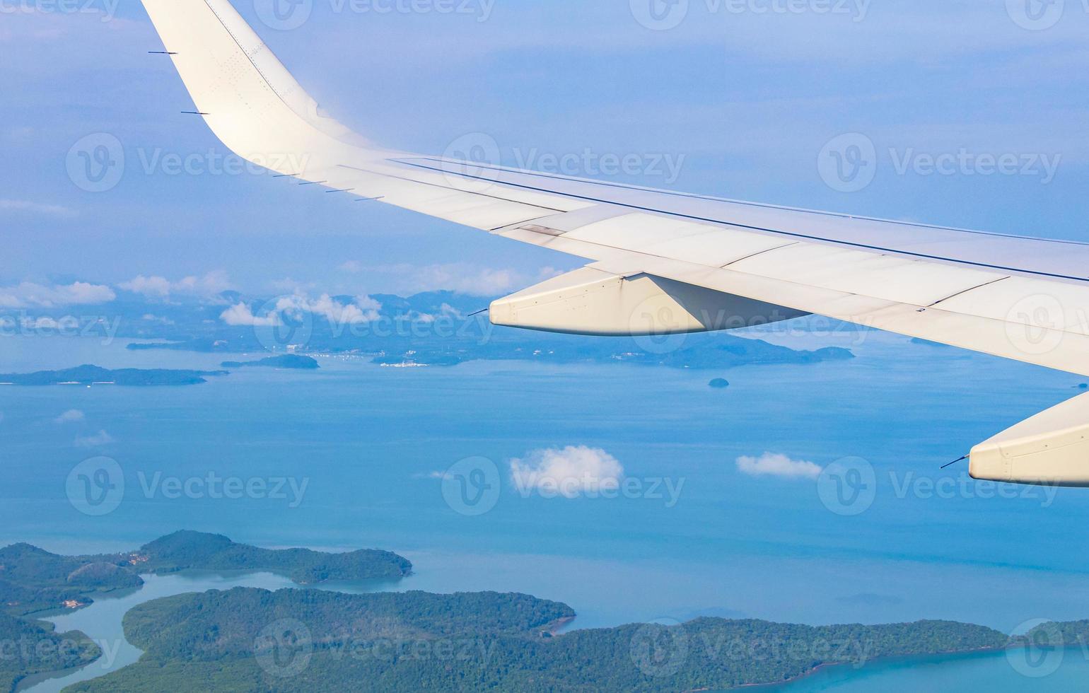 Flying over Thailand panoramic view of islands beaches turquoise waters. photo